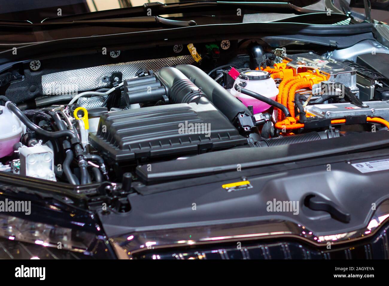 Under the hood of a hybrid or electric car. Detail of electric car engine. Stock Photo
