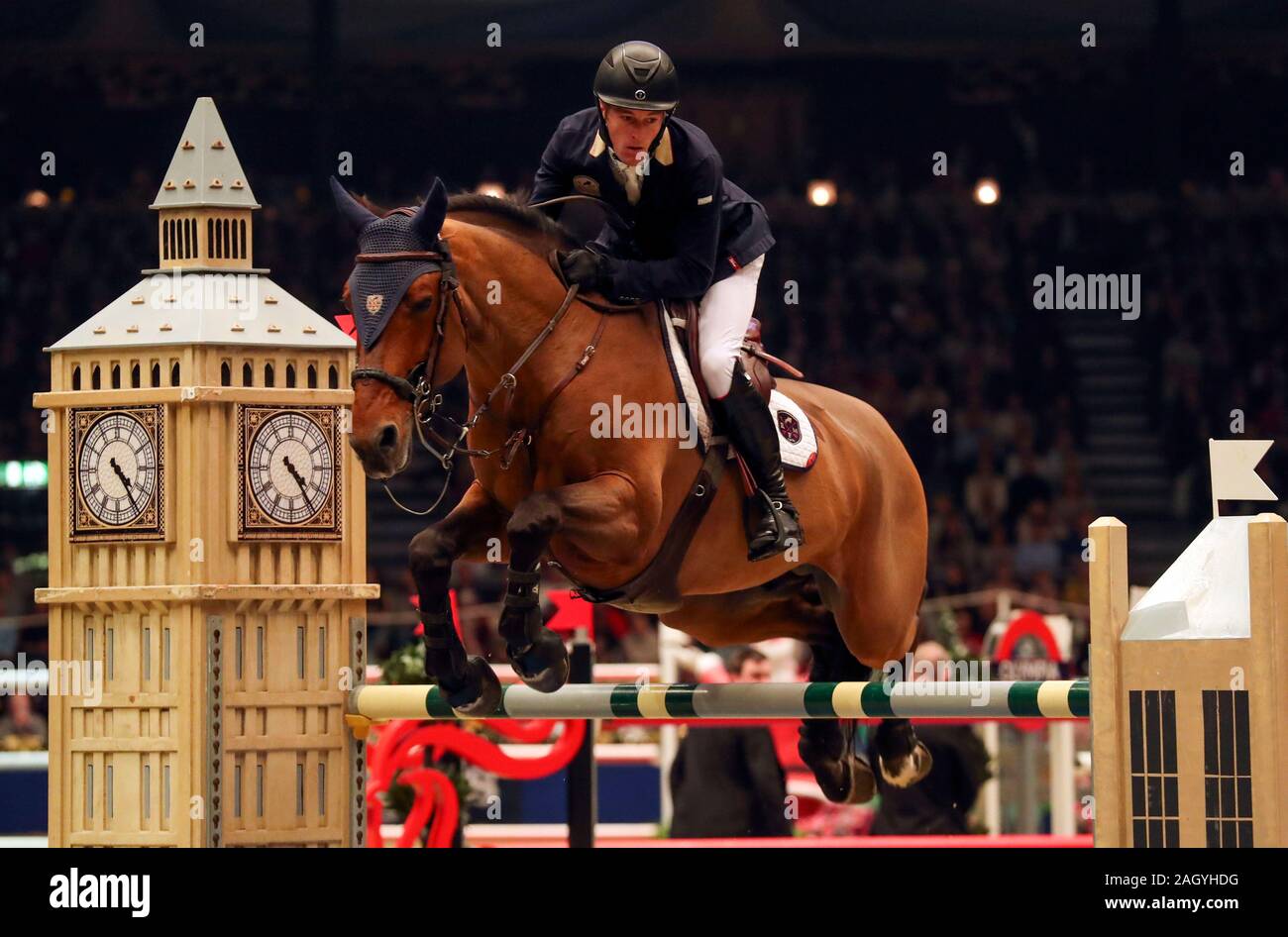 William Whitaker RMF Cadeau de Muze competes in the Turkish Airlines Olympia Grand Prix during day seven of The London International Horse Show at London Olympia. Stock Photo