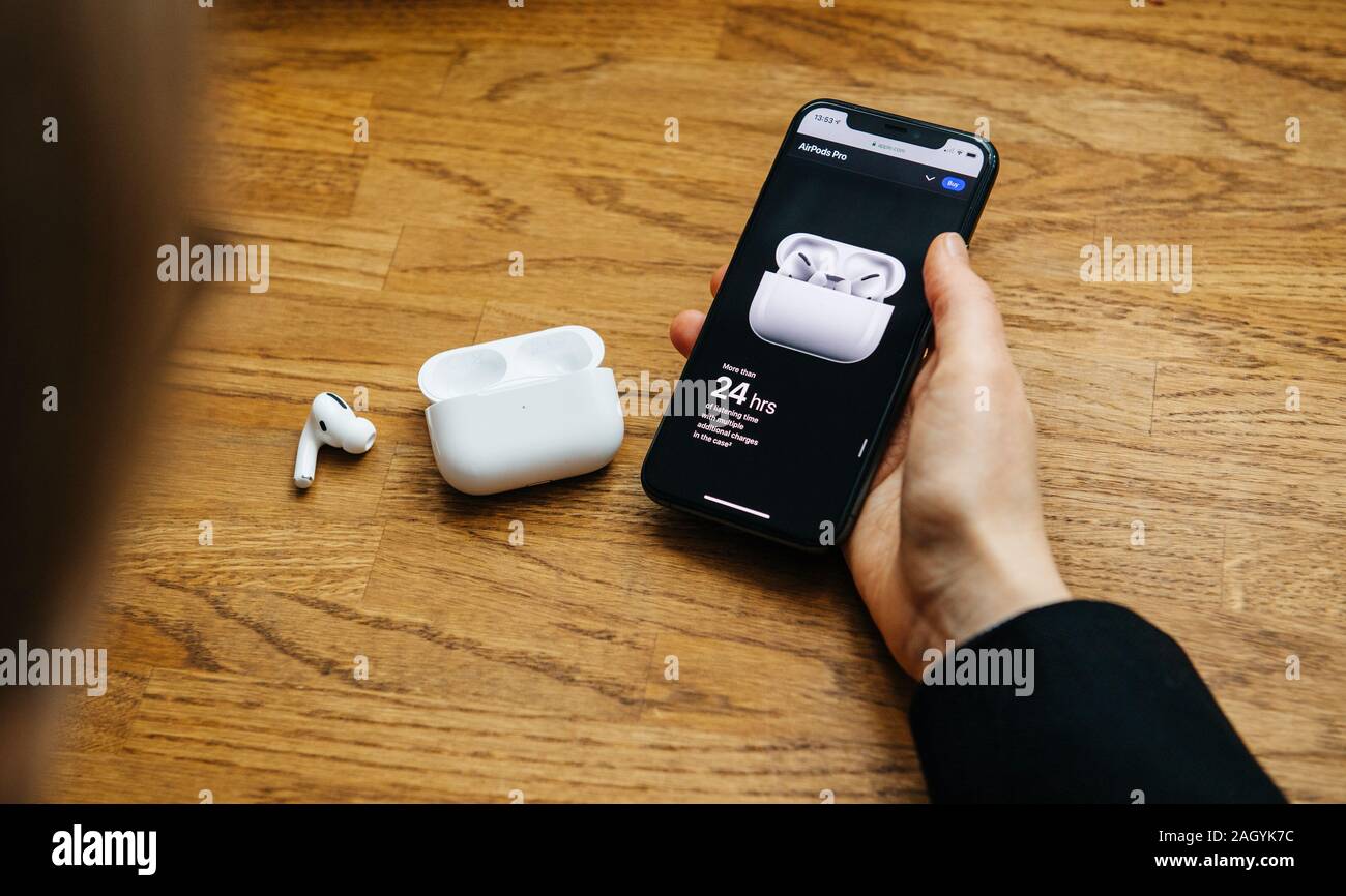 iPhone 11 Pro with AirPods Pro and Apple Watch with a Macbook in the  background Stock Photo - Alamy