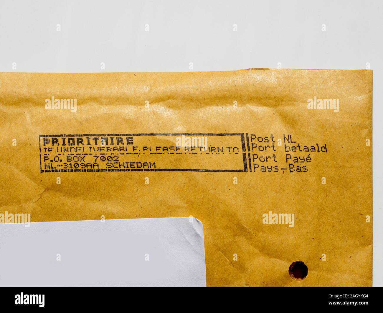 Amsterdam, Netherlands - Aug 9, 2017: Detail of business envelope from Post NL Netherlands postal service with Prioritaire stamp printed on dot matrix printer Stock Photo