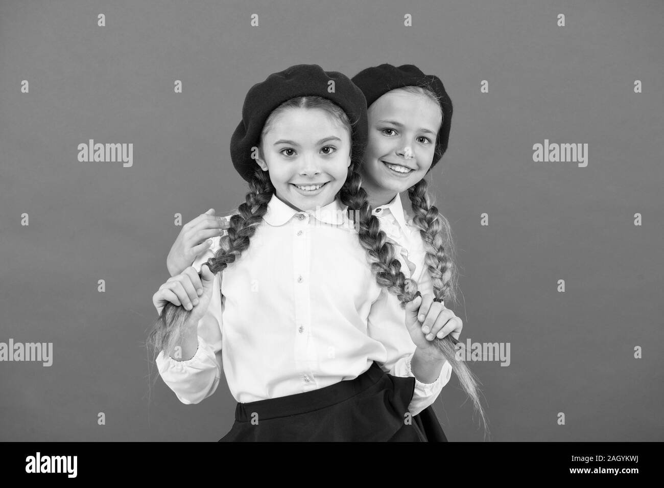 True friends always stand beside you. Friendship means support. Girls best friends on red