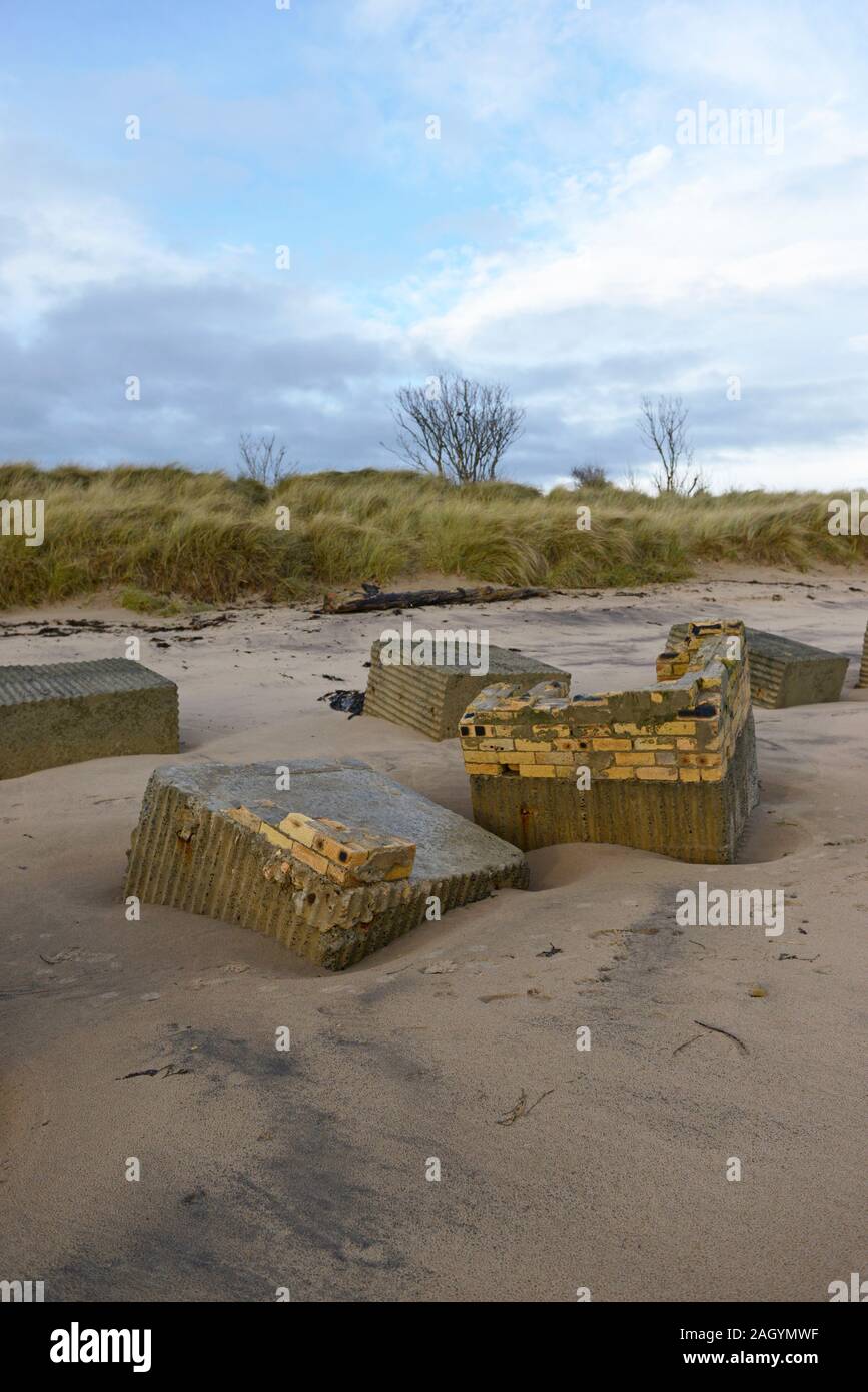 World War two anti-tank barricades remain in place seventy years on, on Alnmouth beach, Northumberland, UK Stock Photo