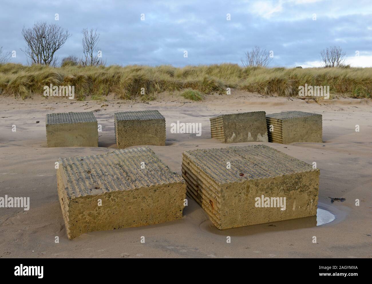 World War two anti-tank barricades remain in place seventy years on, on Alnmouth beach, Northumberland, UK Stock Photo