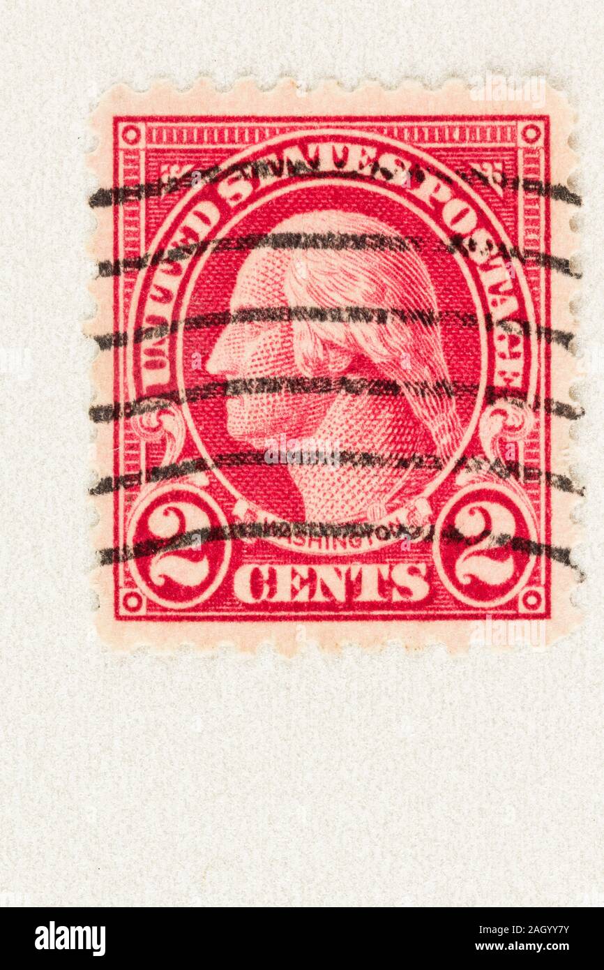 Red 2 cent USA postage stamp featuring George Washington, a farmer, statesman, military commander, and 1st President of the United States. Stock Photo