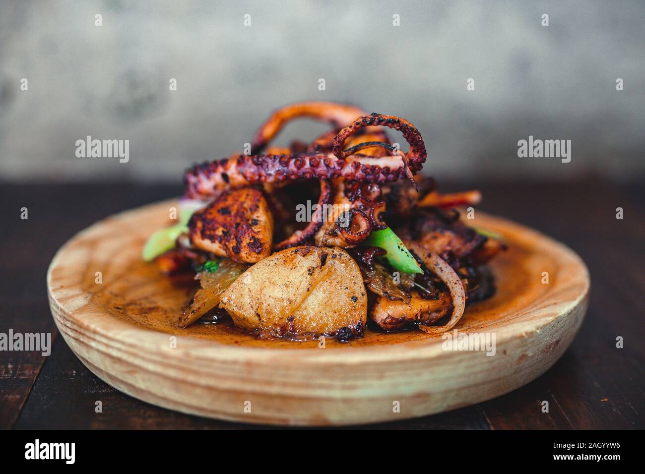 Spanish pulpo served up on a rustic dish in a Spanish tapas bar in Nashville, TN. Stock Photo