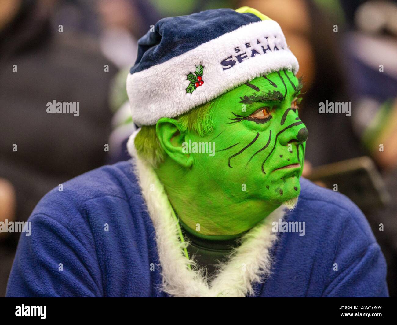 Seattle, United States. 22nd Dec, 2019. A Seattle Seahawks fan, dress as  The Grinch, stares at the score board clock at time ticked away in their  13-27 loss to the Arizona Cardinals.