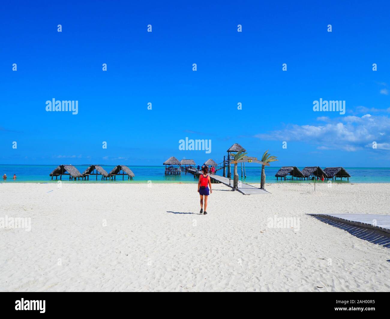 Girl and Water Bungalows Stock Photo