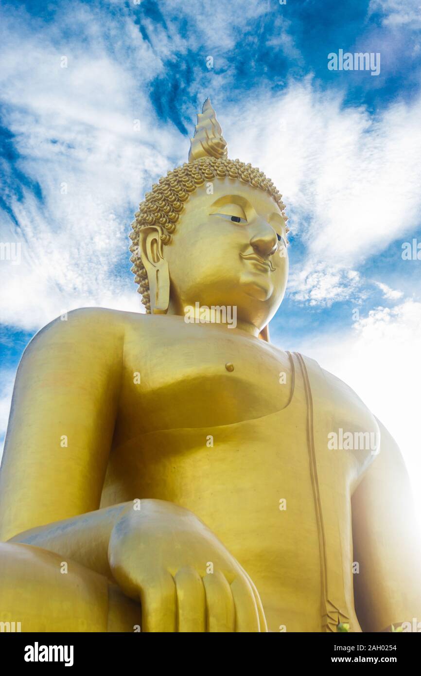 Golden buddha of statue on blue sky background in thailand Stock Photo ...