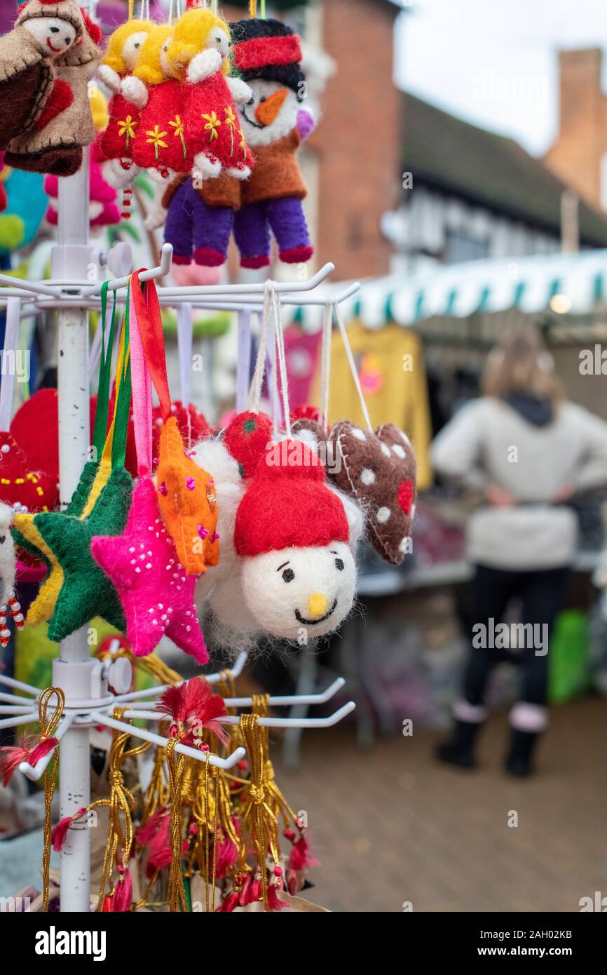 Handmade soft toy christmas tree decorations on a stall at a victorian christmas market. Stratford Upon Avon, Warwickshire, England Stock Photo