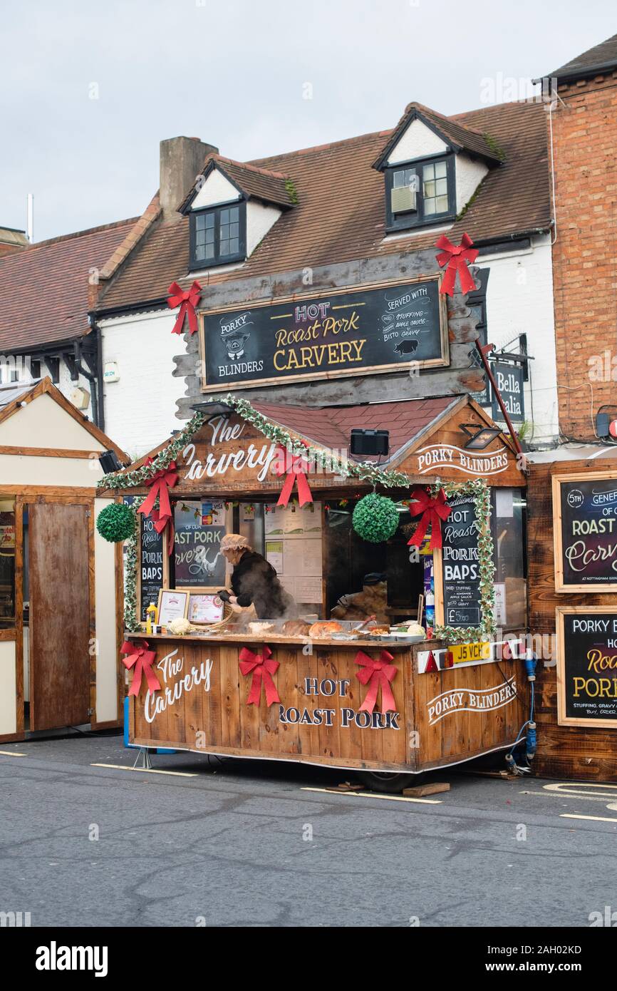 Roast pork carvery stall at a victorian christmas market. Stratford Upon Avon, Warwickshire, England Stock Photo