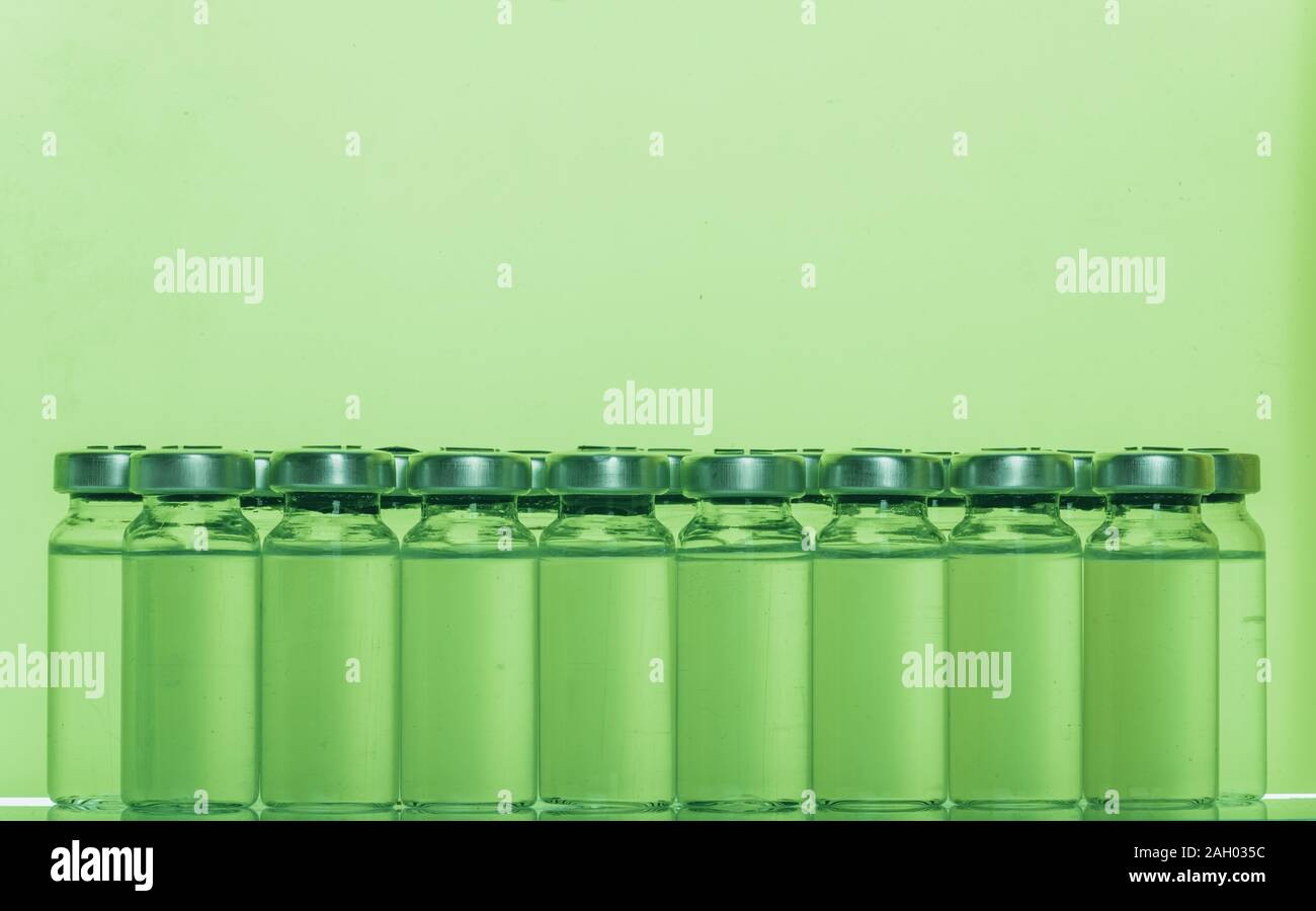 Glass medical ampoule vial for injection. Medicine is liquid sodium