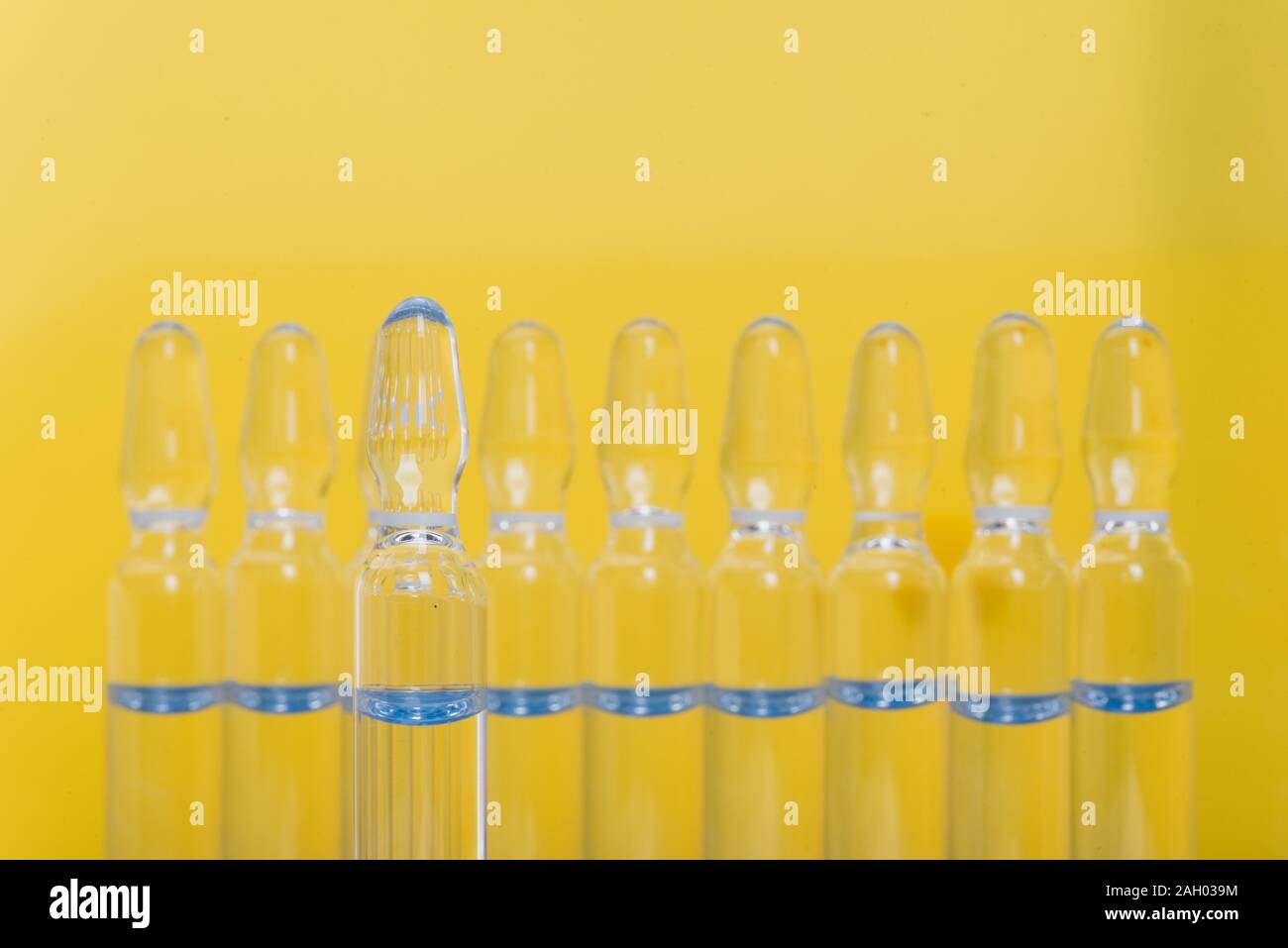 Glass medical ampoule vial for injection. Medicine is liquid sodium