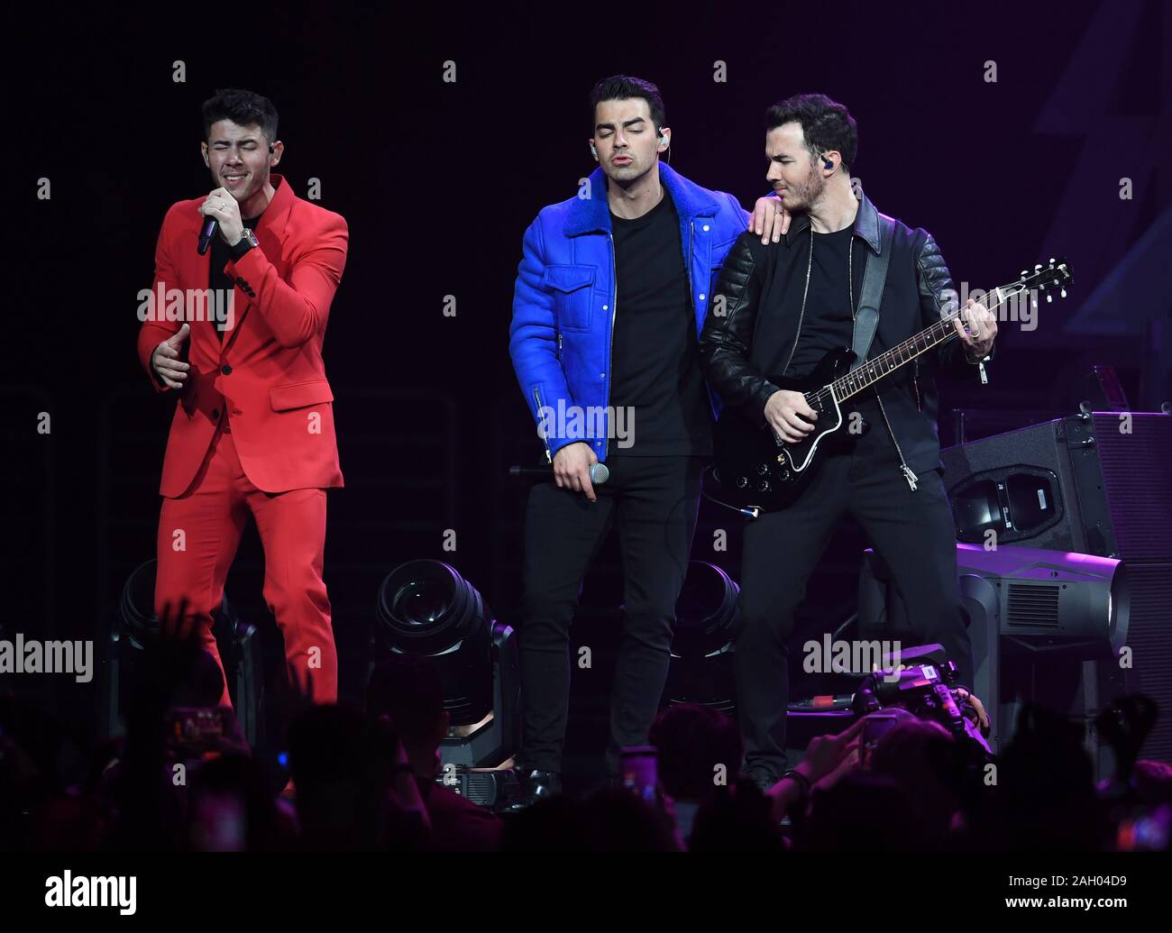 Sunrise FL, USA. 22nd Dec, 2019. The Jonas Brothers perform during Y100 Jingle Ball 2019 at The BB&T Center on December 22, 2019 in Sunrise, Florida. Credit: Mpi04/Media Punch/Alamy Live News Stock Photo