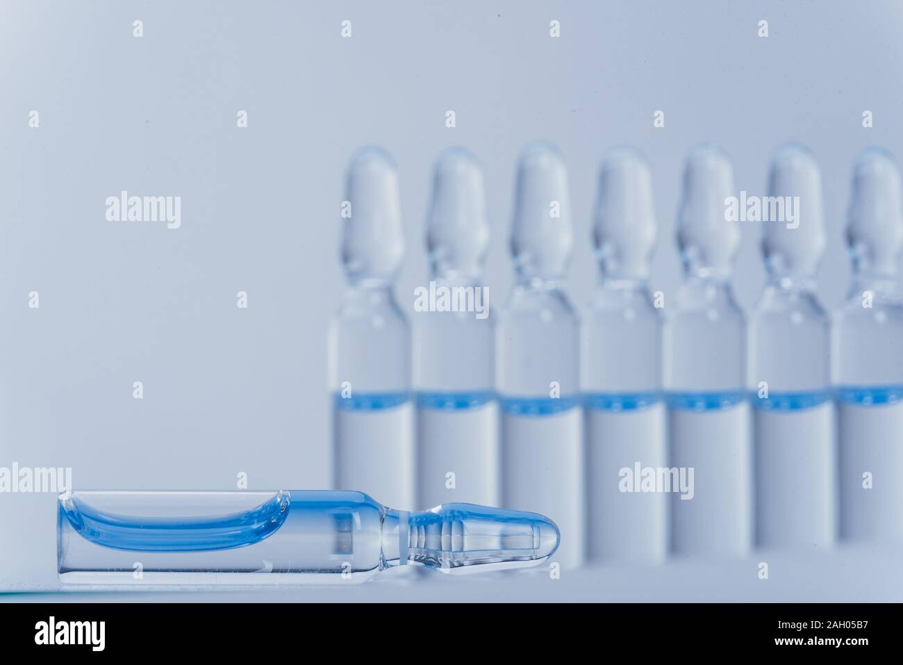 Glass medical ampoule vial for injection. Medicine is liquid sodium