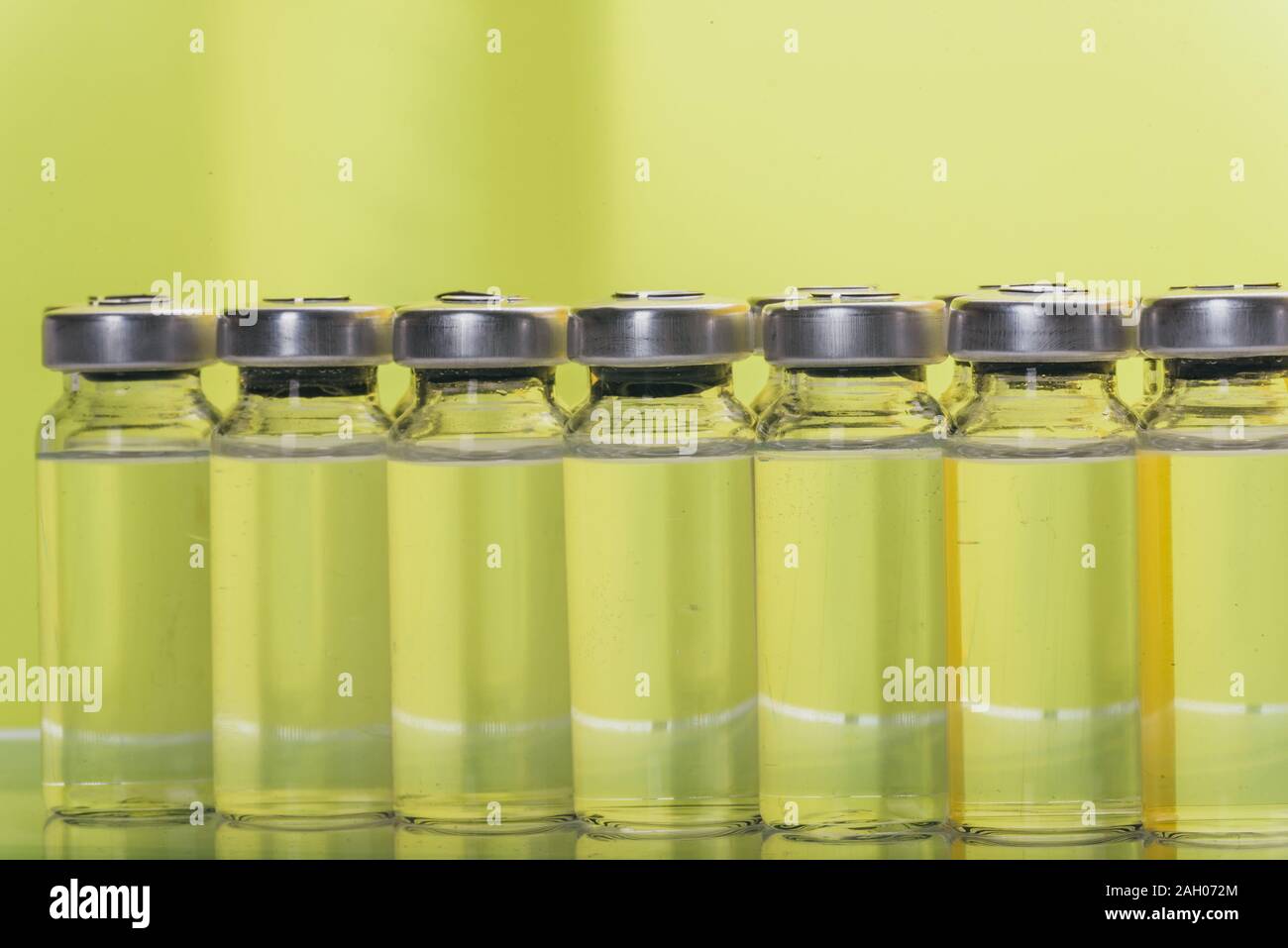 Glass medical ampoule vial for injection. Medicine is liquid sodium chloride with of aqueous