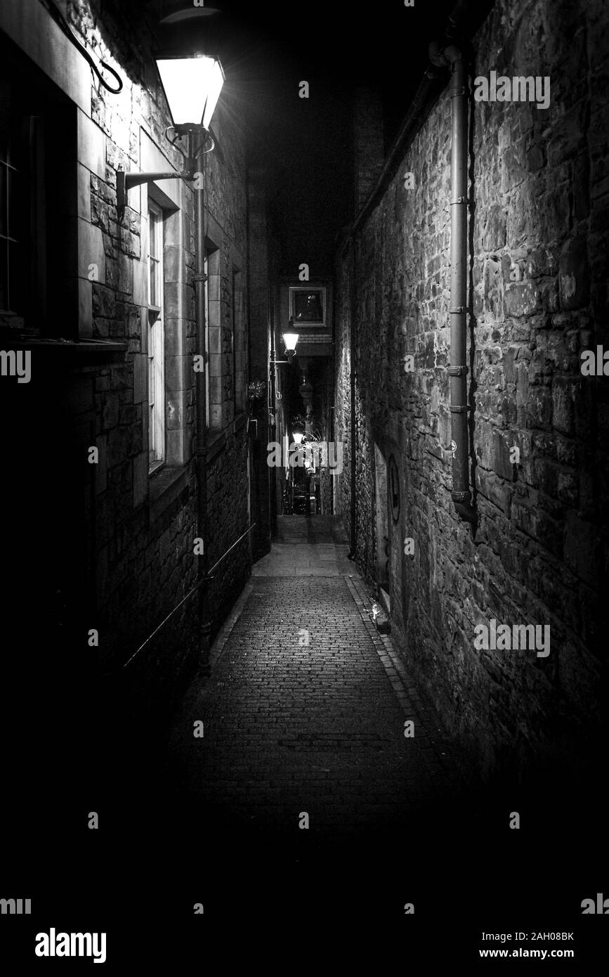 A Dark Creepy Narrow European Alley At Night Surrounded By Bricks And Cobblestone Illuminated Only With Some Street Lamps Concept Of Scared Or Stock Photo Alamy A Dark Creepy Narrow European Alley At Night Surrounded By Bricks And Cobblestone Illuminated Only With Some Street Lamps Concept Of Scared Or Stock Photo Alamy