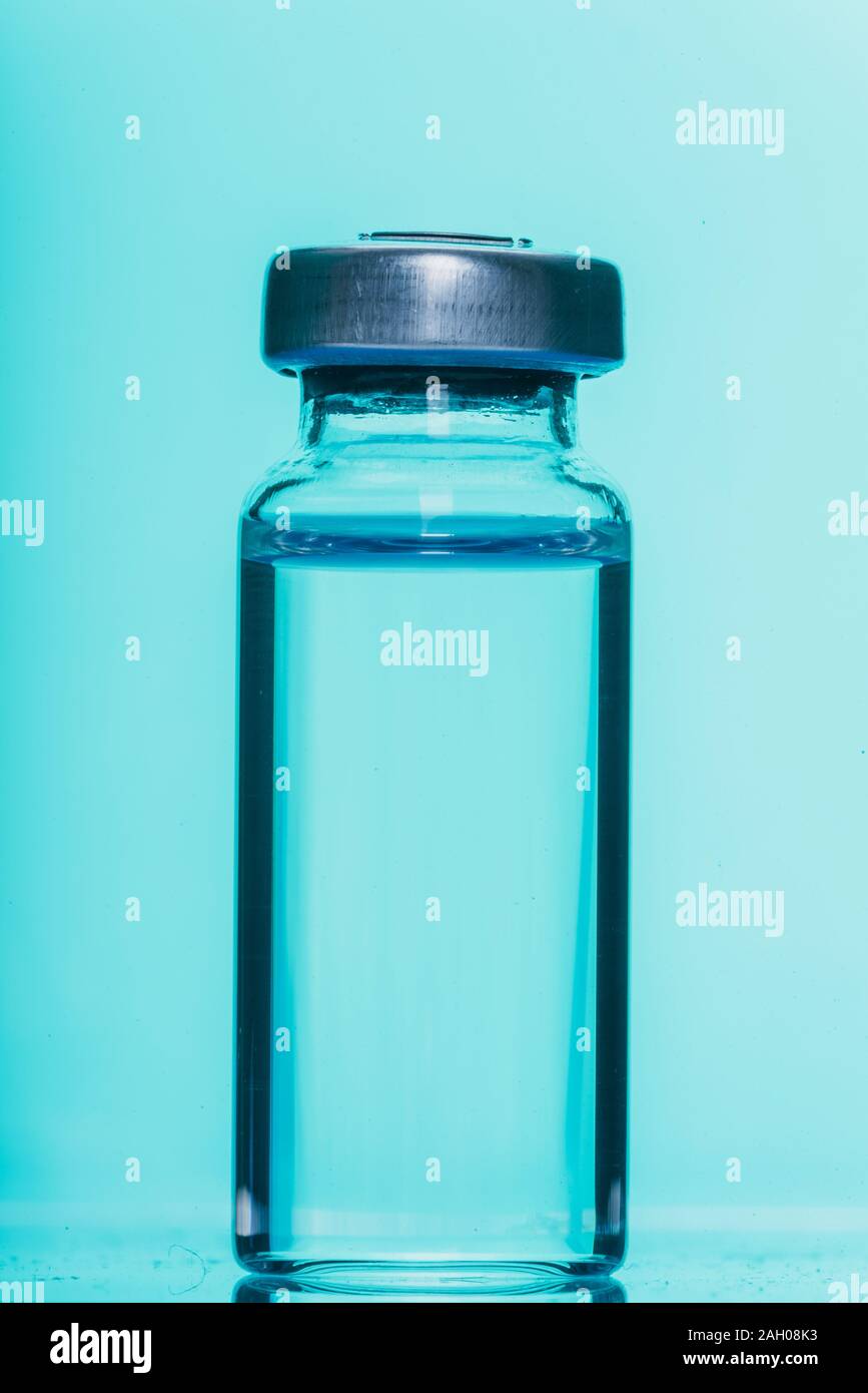 Glass medical ampoule vial for injection. Medicine is liquid sodium