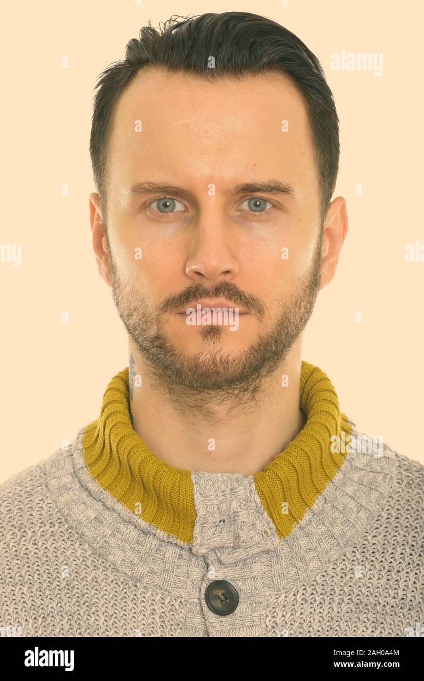 Face of young man wearing knitted sweater Stock Photo