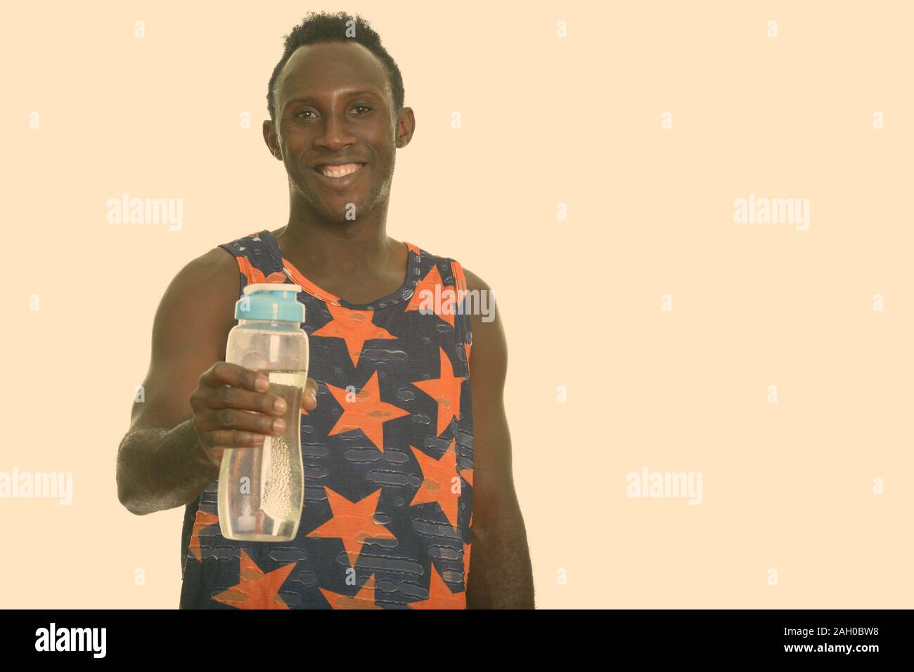 https://c8.alamy.com/comp/2AH0BW8/young-happy-black-african-man-smiling-and-giving-water-bottle-2AH0BW8.jpg