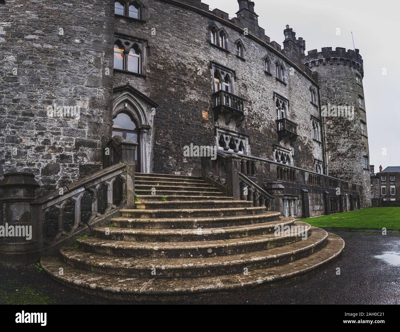 KILKENNY, IRELAND, DECEMBER 23, 2018: Panoramic view of Kilkenny Castle entrance staircase on a dramatic cloudy day. Stock Photo