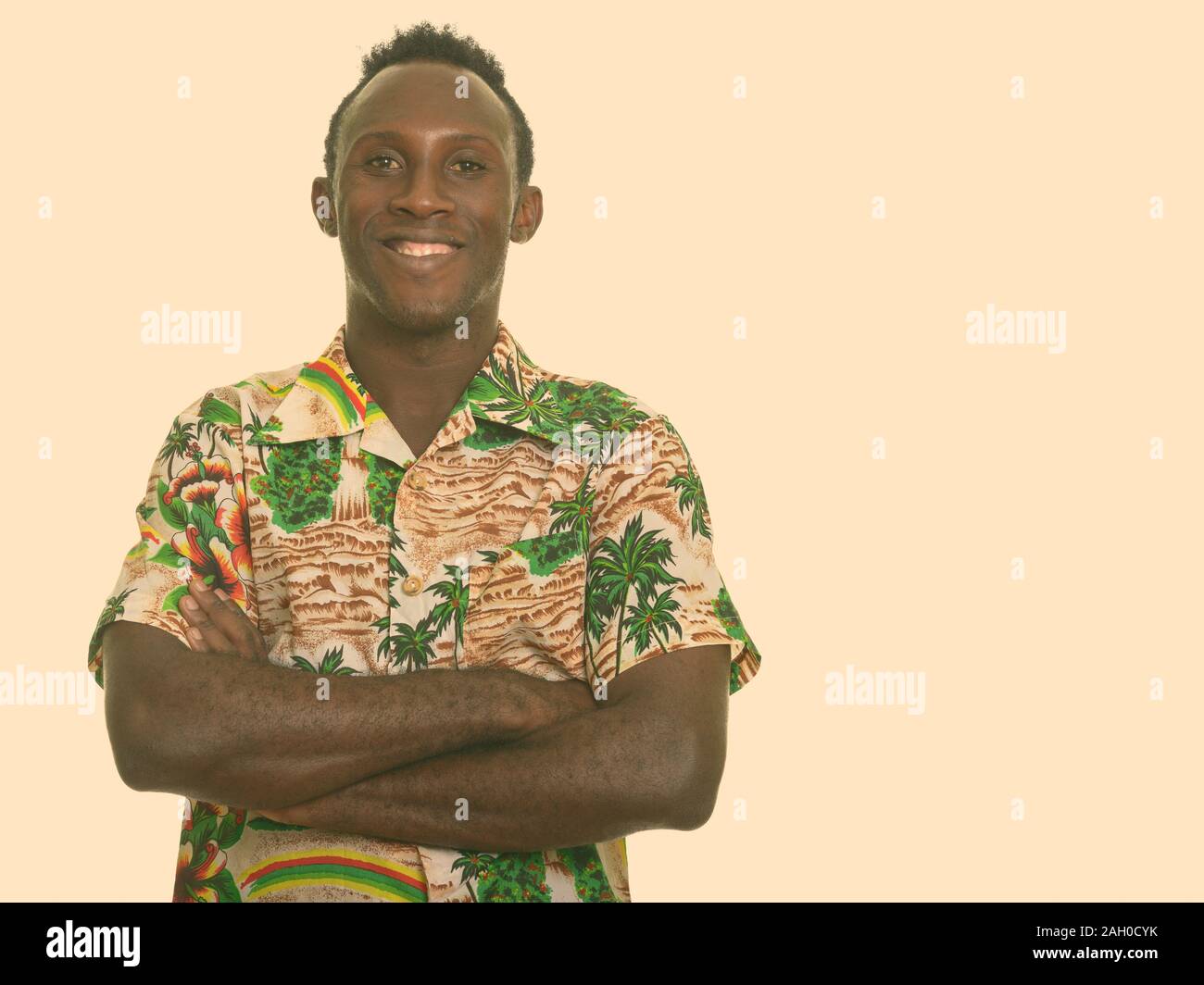 Young happy black African man smiling with arms crossed Stock Photo - Alamy