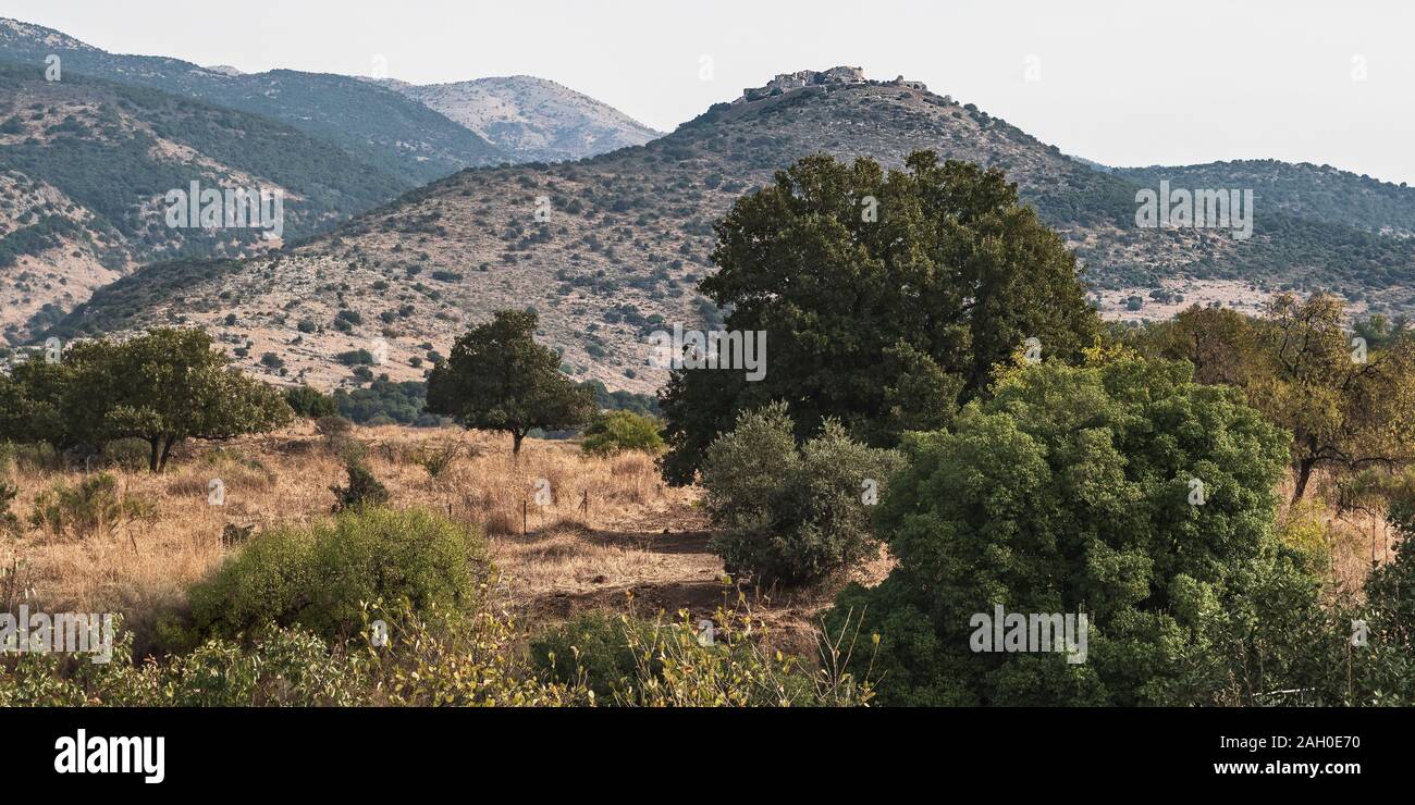 nimrod fortress sits on a peak above the hermon stream nature reserve in the golan heights  israel with mt hermon in the left background Stock Photo