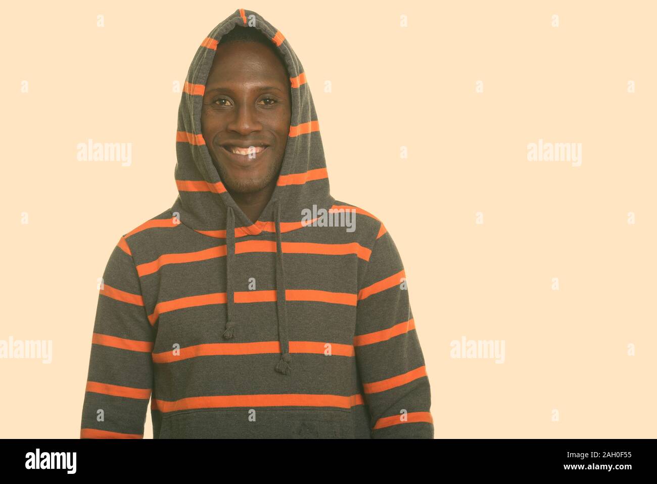 Young happy black African man smiling and wearing hoodie Stock Photo ...