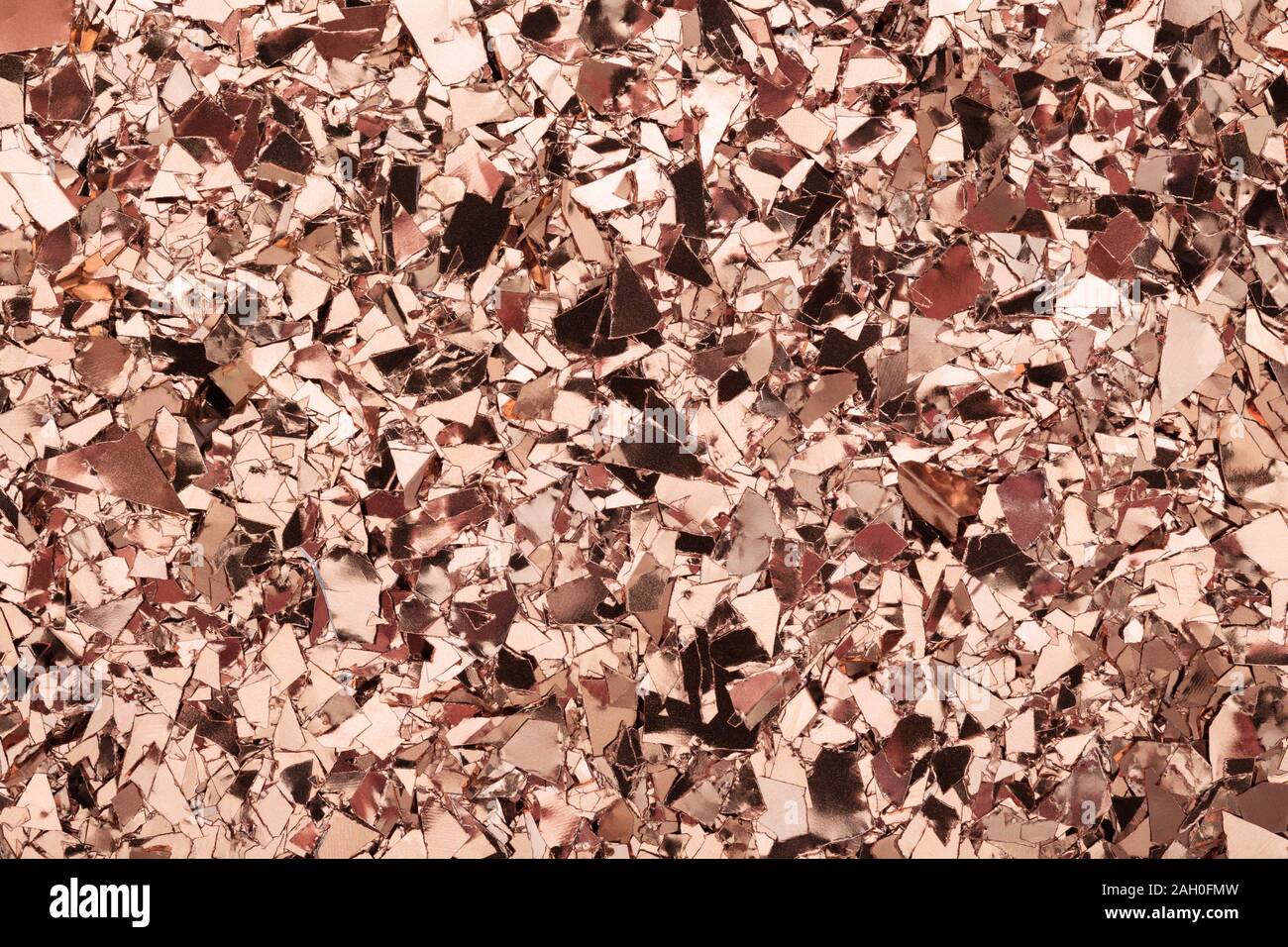 Pink Gold glitter foil confetti background. Festive, party or holiday backdrop. Flat-lay, close-up. Stock Photo