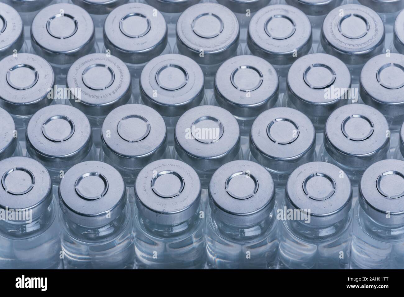 Glass medical ampoule vial for injection. Medicine is dry white drug