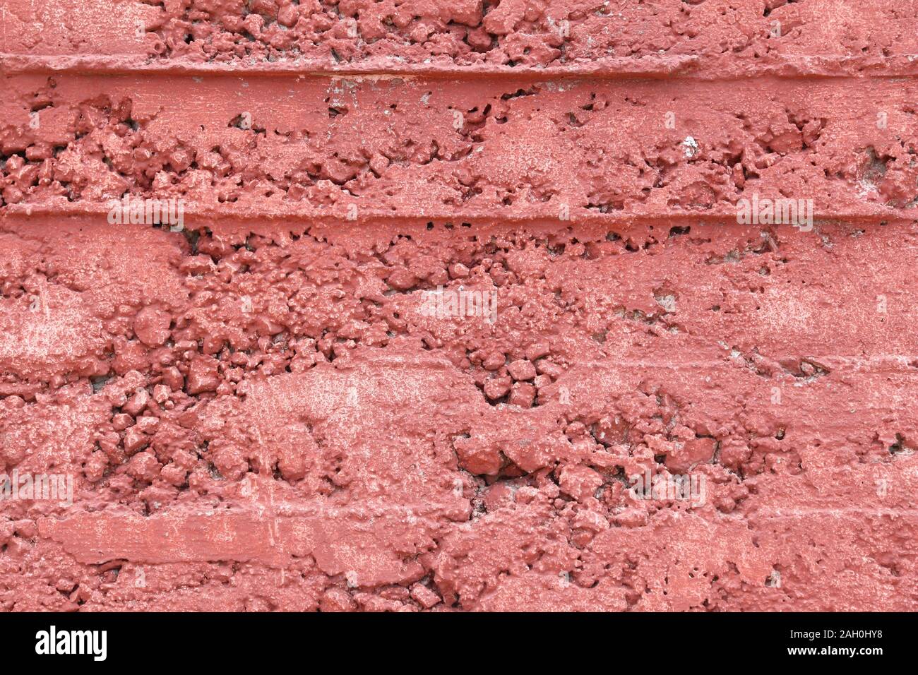 Red grunge wall background. Froly colored texture. Stock Photo