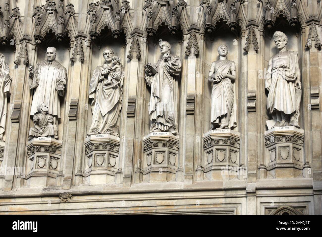London, UK - Westminster Abbey facade detail. Modern Martyrs set of sculptures depicting Martin Luther King Jr, St Oscar Romero, Dietrich Bonhoeffer, Stock Photo