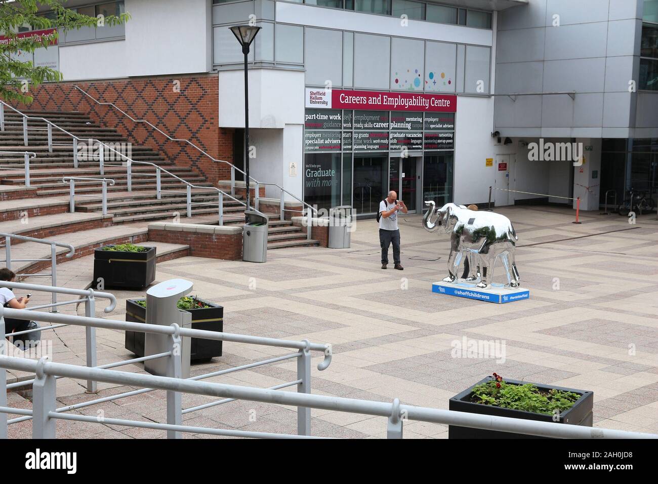 SHEFFIELD, UK - JULY 10, 2016: People visit Sheffield Hallam University in the UK. The public university is 6th largest in the UK with 31,530 students Stock Photo