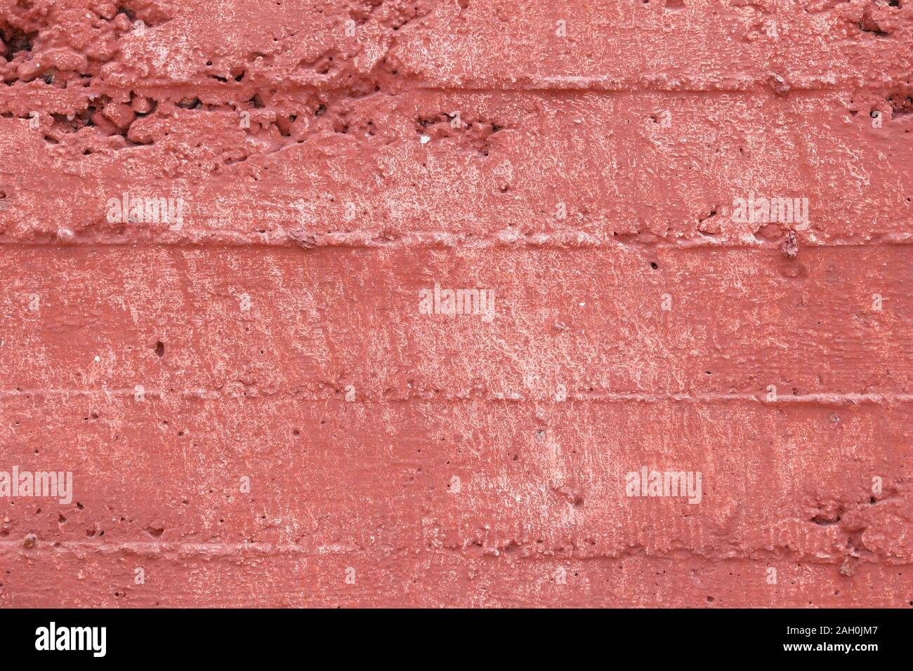 Red grunge wall background. Froly colored texture. Stock Photo
