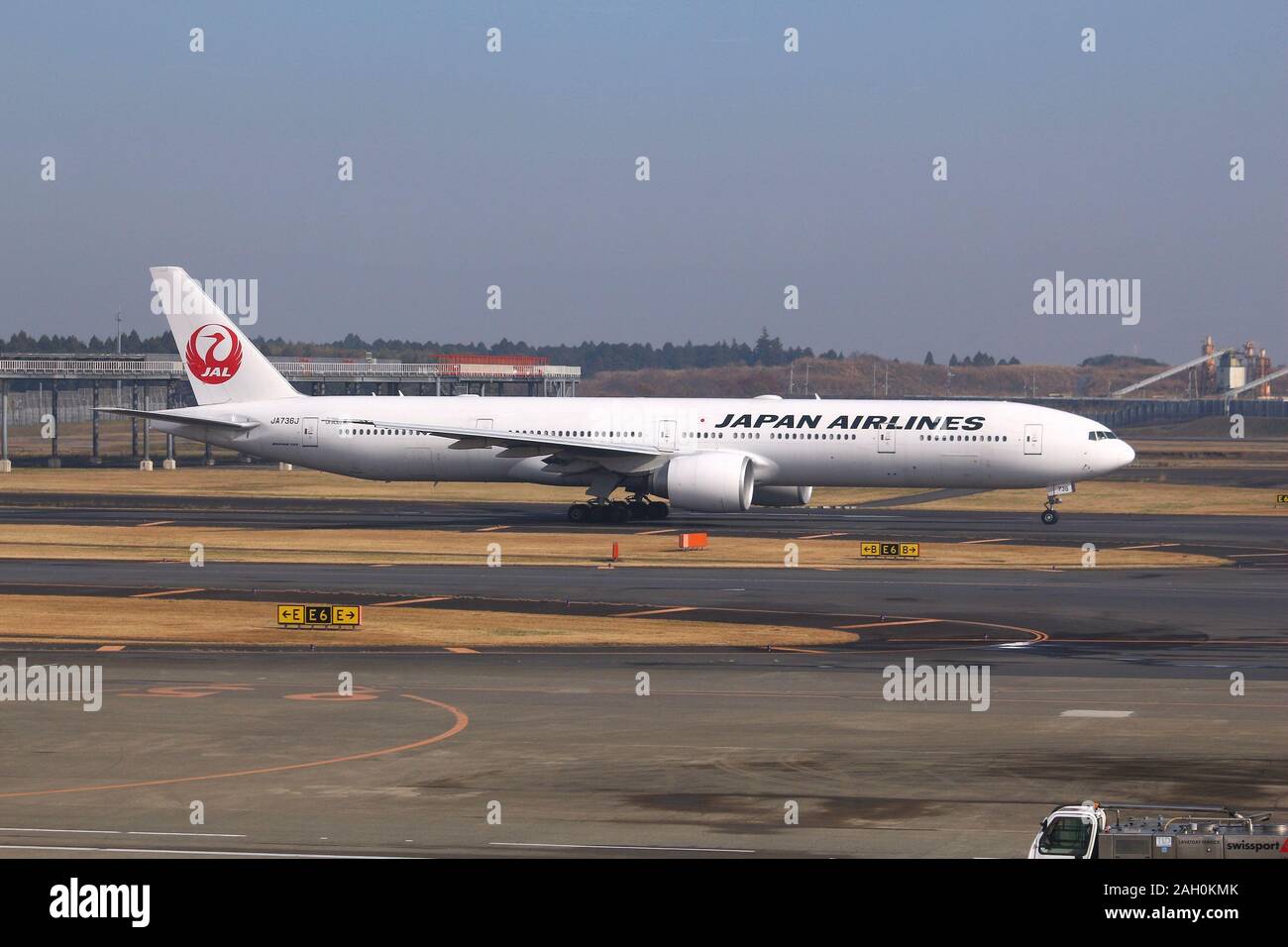 TOKYO, JAPAN - DECEMBER 5, 2016: Japan Airlines Boeing 777 taxiing at Narita Airport of Tokyo. The airport is the 2nd busiest airport of Japan (after Stock Photo