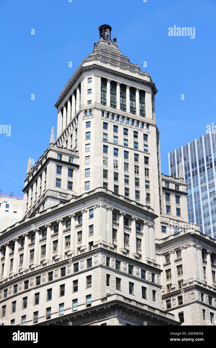 NEW YORK, USA - JULY 6, 2013: 26 Broadway Building exterior view in New York. The 520 ft building is owned by real estate firm Newmark Grubb Knight Fr Stock Photo