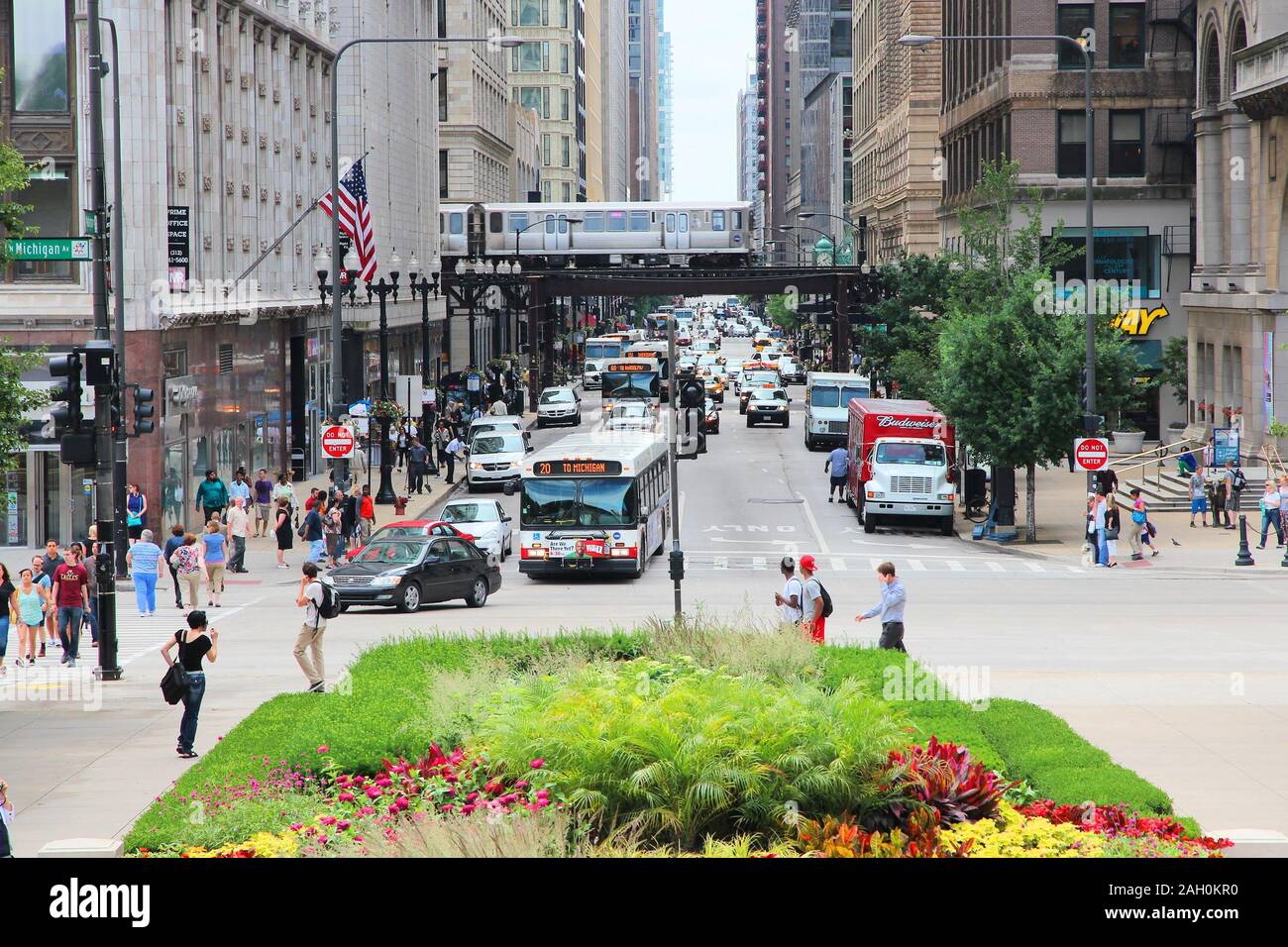 CHICAGO, USA - JUNE 26, 2013: People drive downtown in Chicago. Chicago is the 3rd most populous US city with 2.7 million residents (8.7 million in it Stock Photo