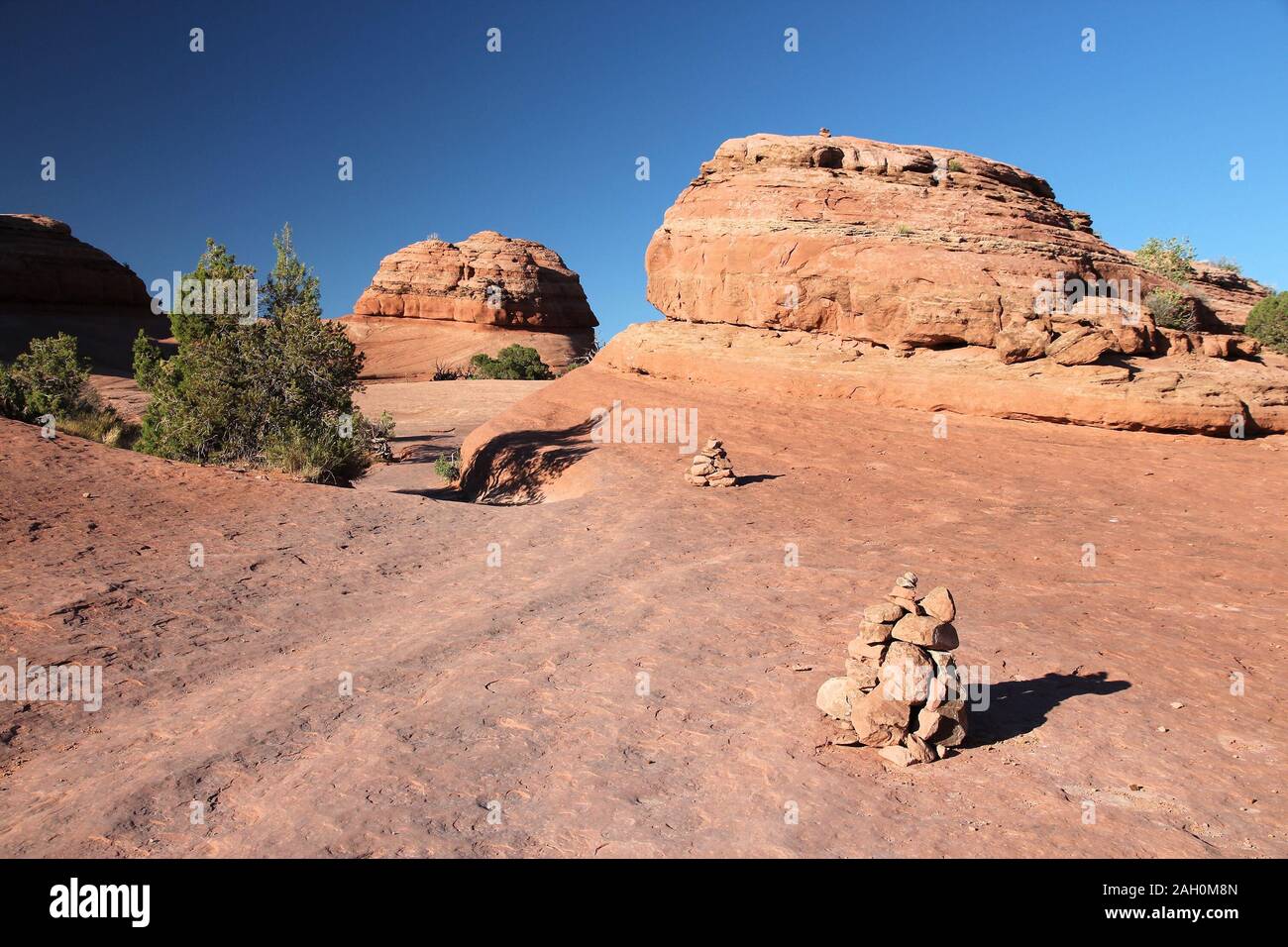 Hiking trail in Utah, United States. Cairns trail marking in Arches National Park. Stock Photo