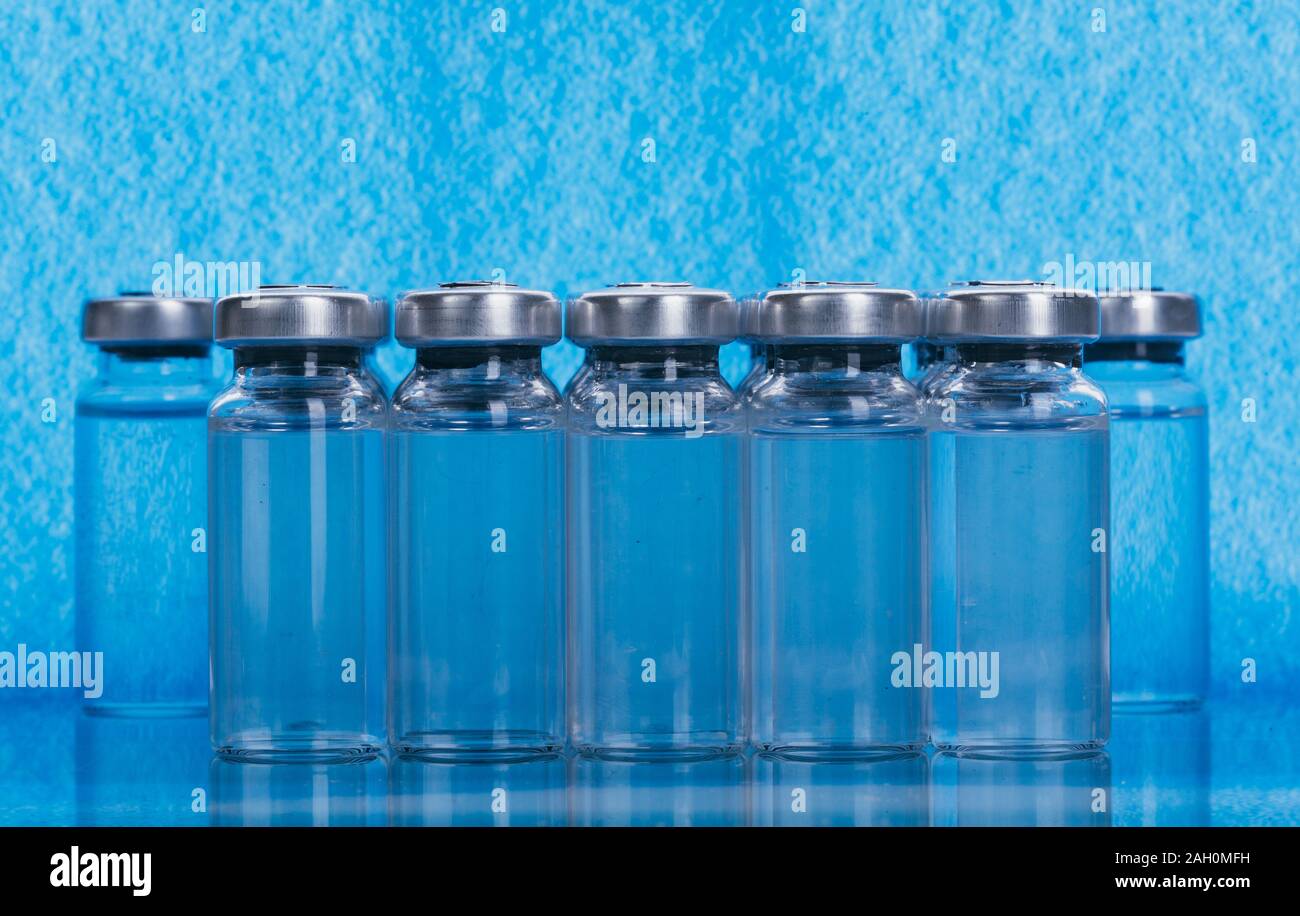 Glass medical ampoule vial for injection. Medicine is liquid sodium chloride with of aqueous