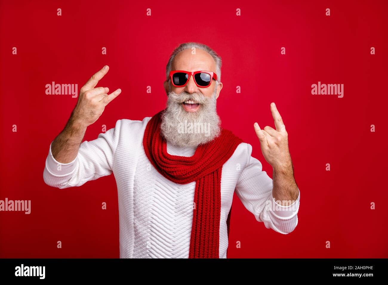 Modern Santa Character Aged Man Showing Horns Heavy Metal Fan Wear Sun Specs Knitted Clothes Isolated Red Background Stock Photo Alamy