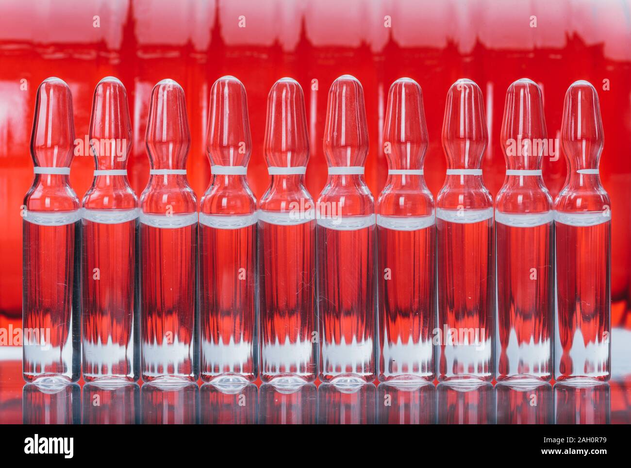 Glass medical ampoule vial for injection. Medicine is liquid sodium chloride with of aqueous