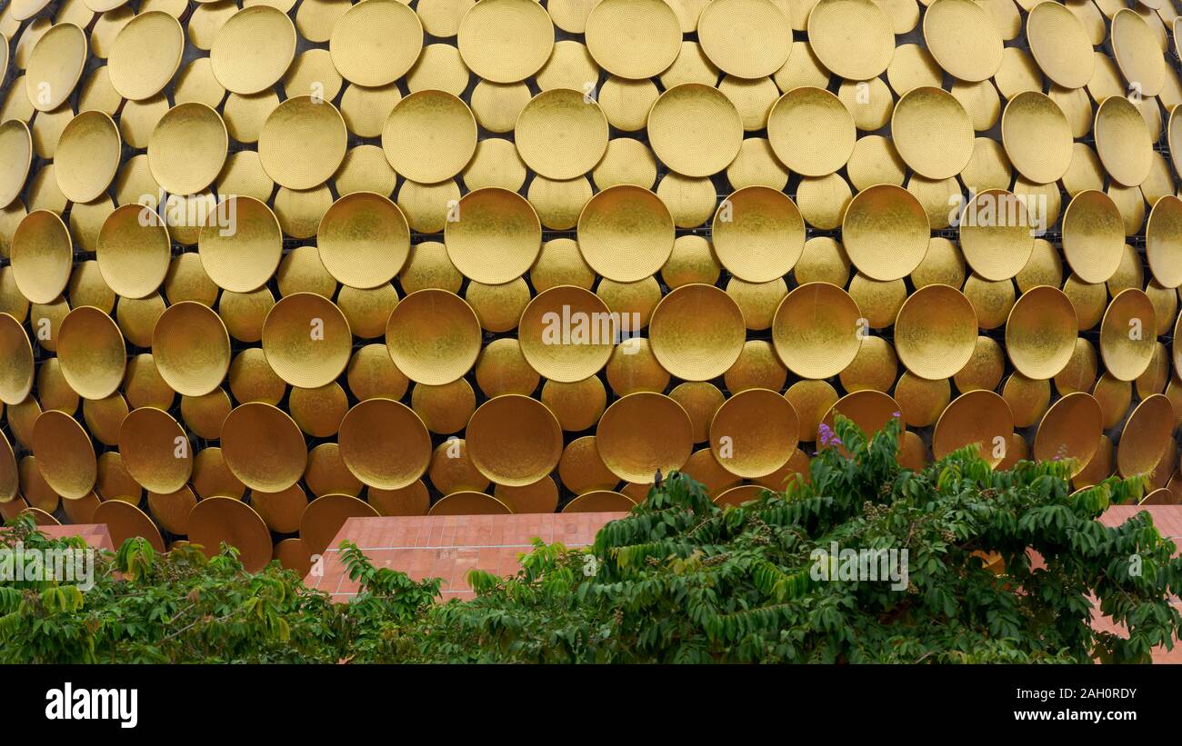 Outer casing made of golden circle plates of Matrimandir in Auroville, South India Stock Photo