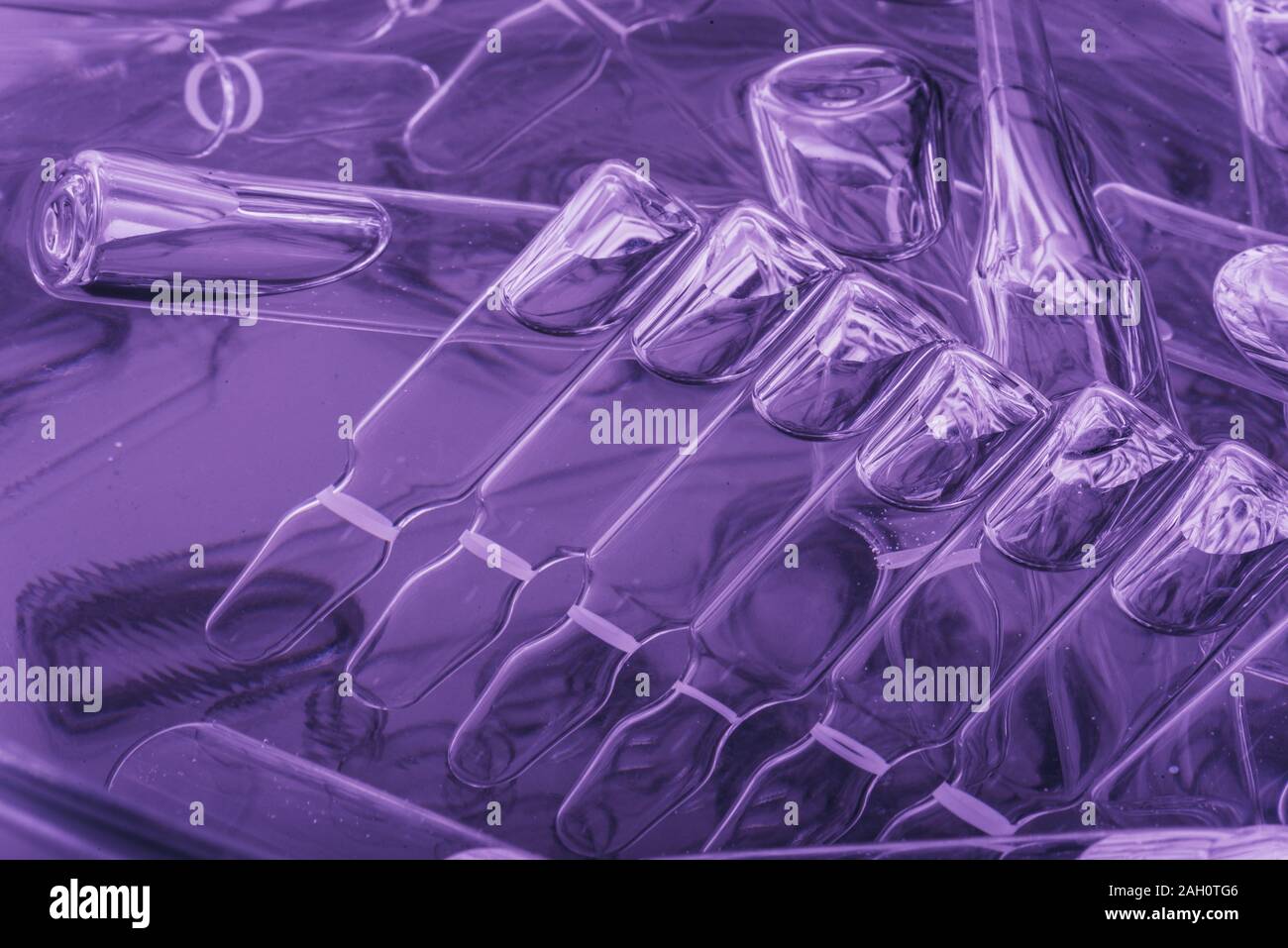 Glass medical ampoule vial for injection. Medicine is liquid sodium