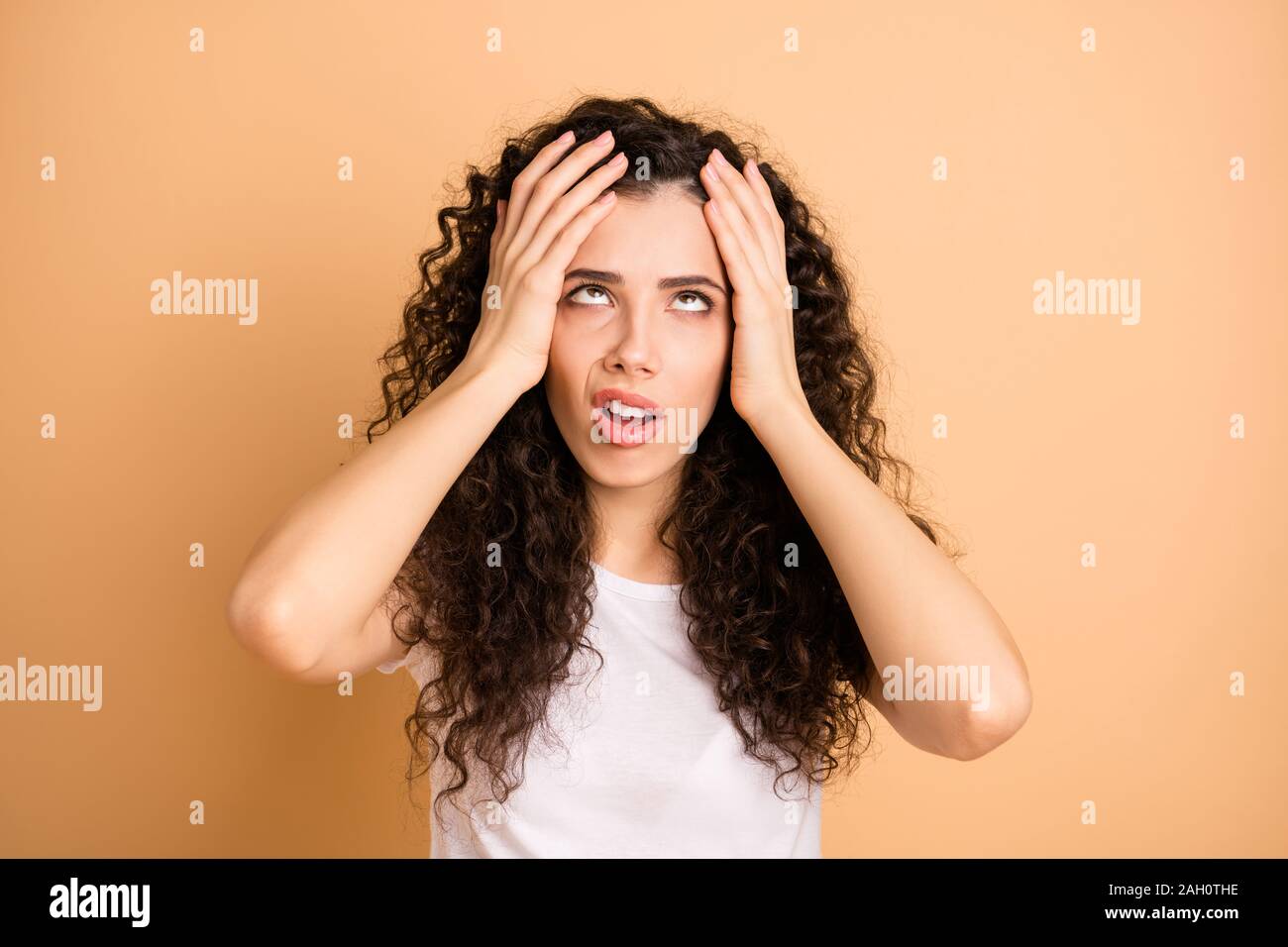 Photo of stressed lady hold arms on head exhausted without days off working day night crossed eyes wear white casual outfit isolated beige pastel Stock Photo