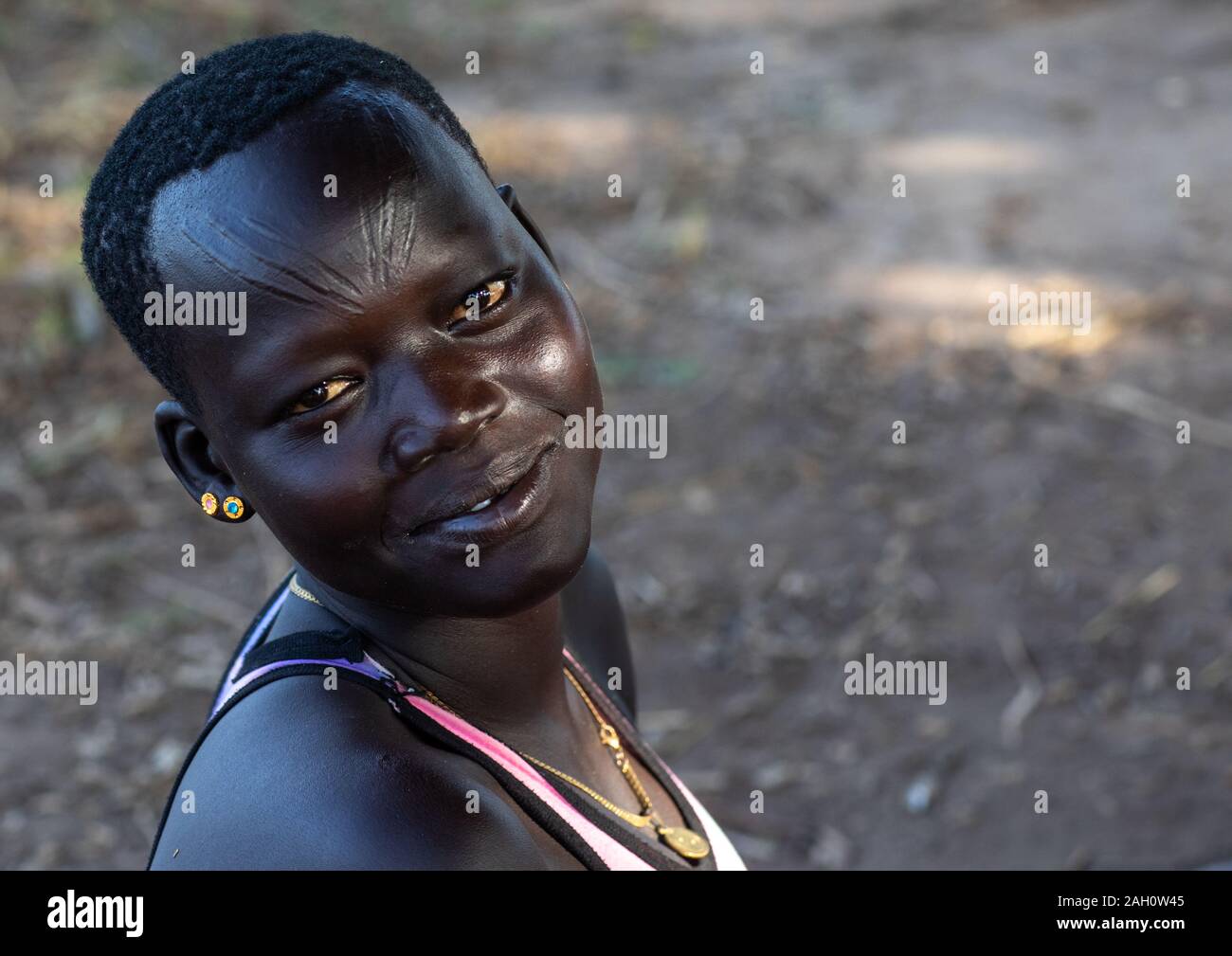 Portrait of a Mundari tribe woman with scarifications on the forehead, Central Equatoria, Terekeka, South Sudan Stock Photo