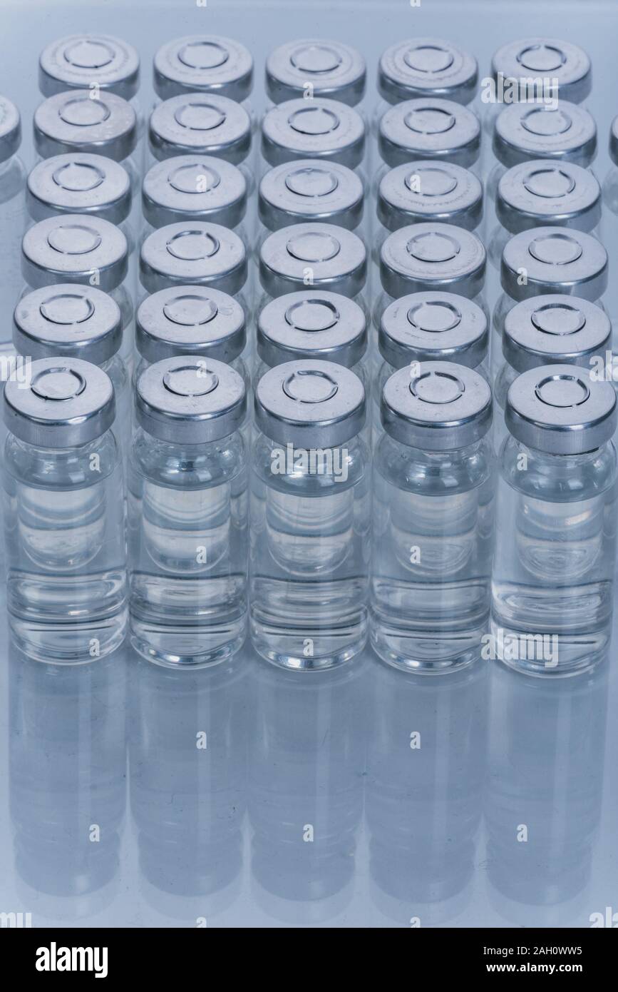 Glass medical ampoule vial for injection. Medicine is dry white drug ...