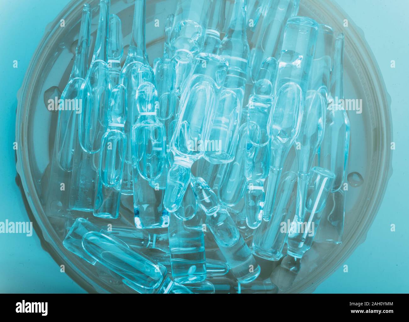 Glass medical ampoule vial for injection. Medicine is liquid sodium