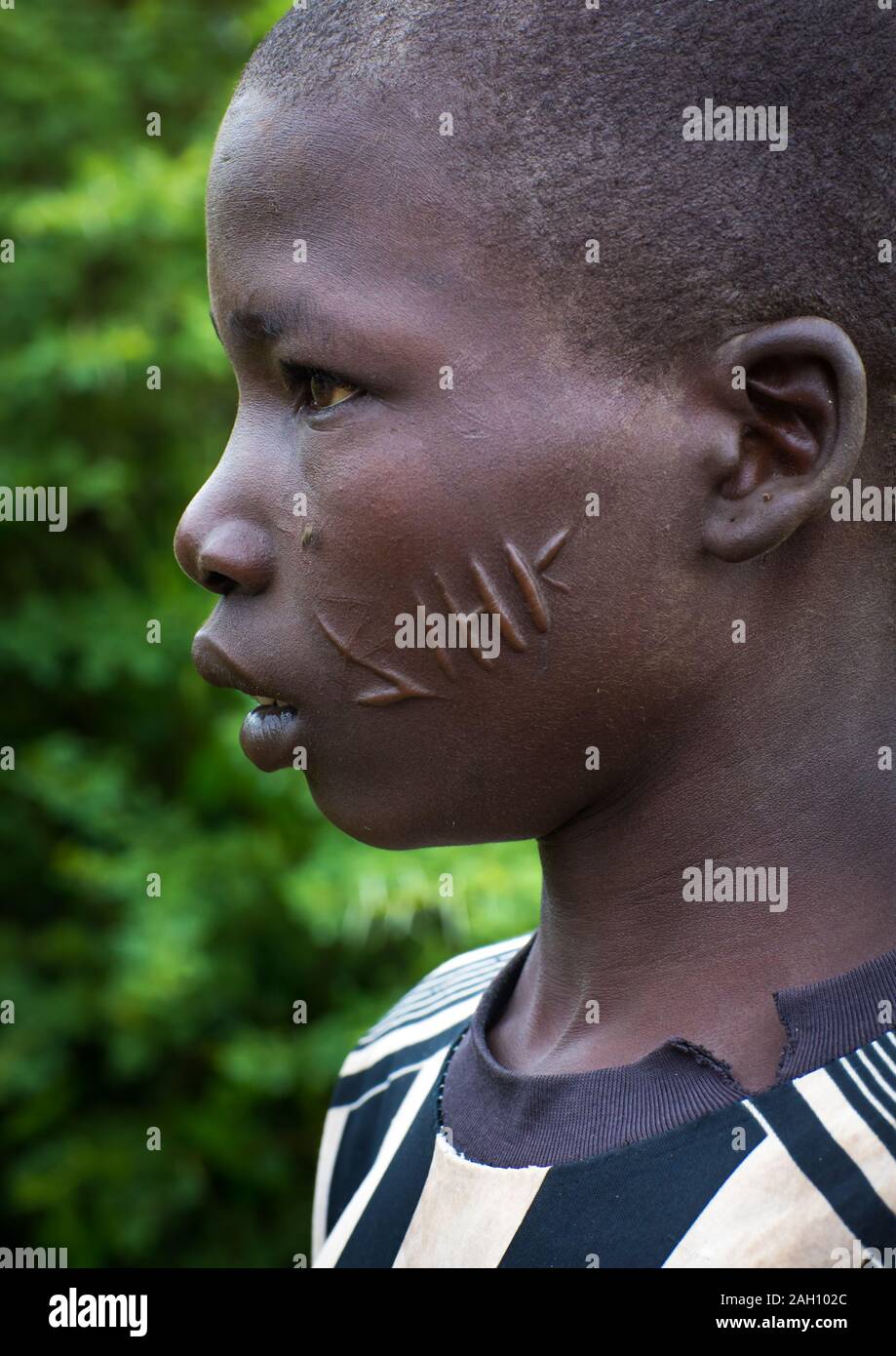 Larim tribe boy with scarifications on the cheek, Boya Mountains, Imatong, South Sudan Stock Photo