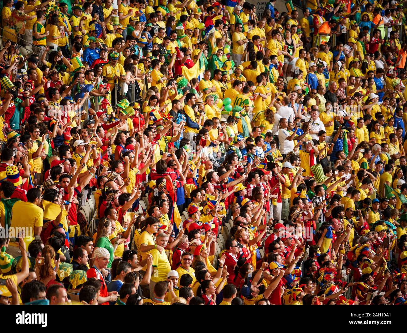 Brazilian and Colombian soccer fans watching an international football match at Fortaleza, Brazil, during the 2014 World Cup. Stock Photo