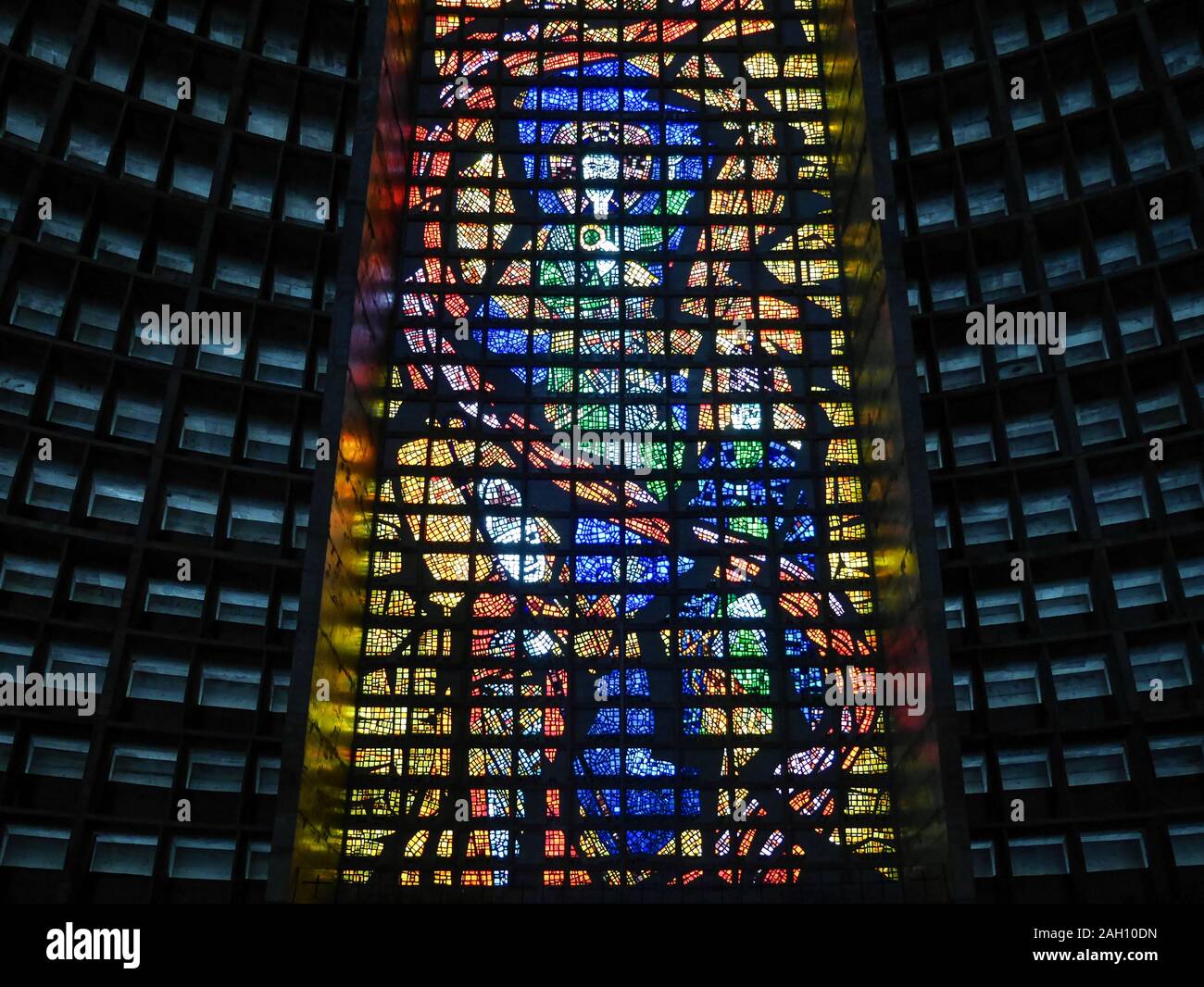 RIO DE JANEIRO, BRAZIL - 10 JULY 2014: Interior detail of the new cathedral in Rio de Janeiro with its brutalist concrete structure decorated by brigh Stock Photo