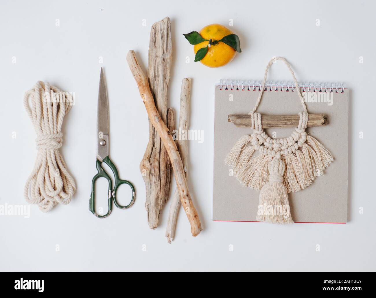Tools and materials for macrame weaving over white surface Stock Photo -  Alamy